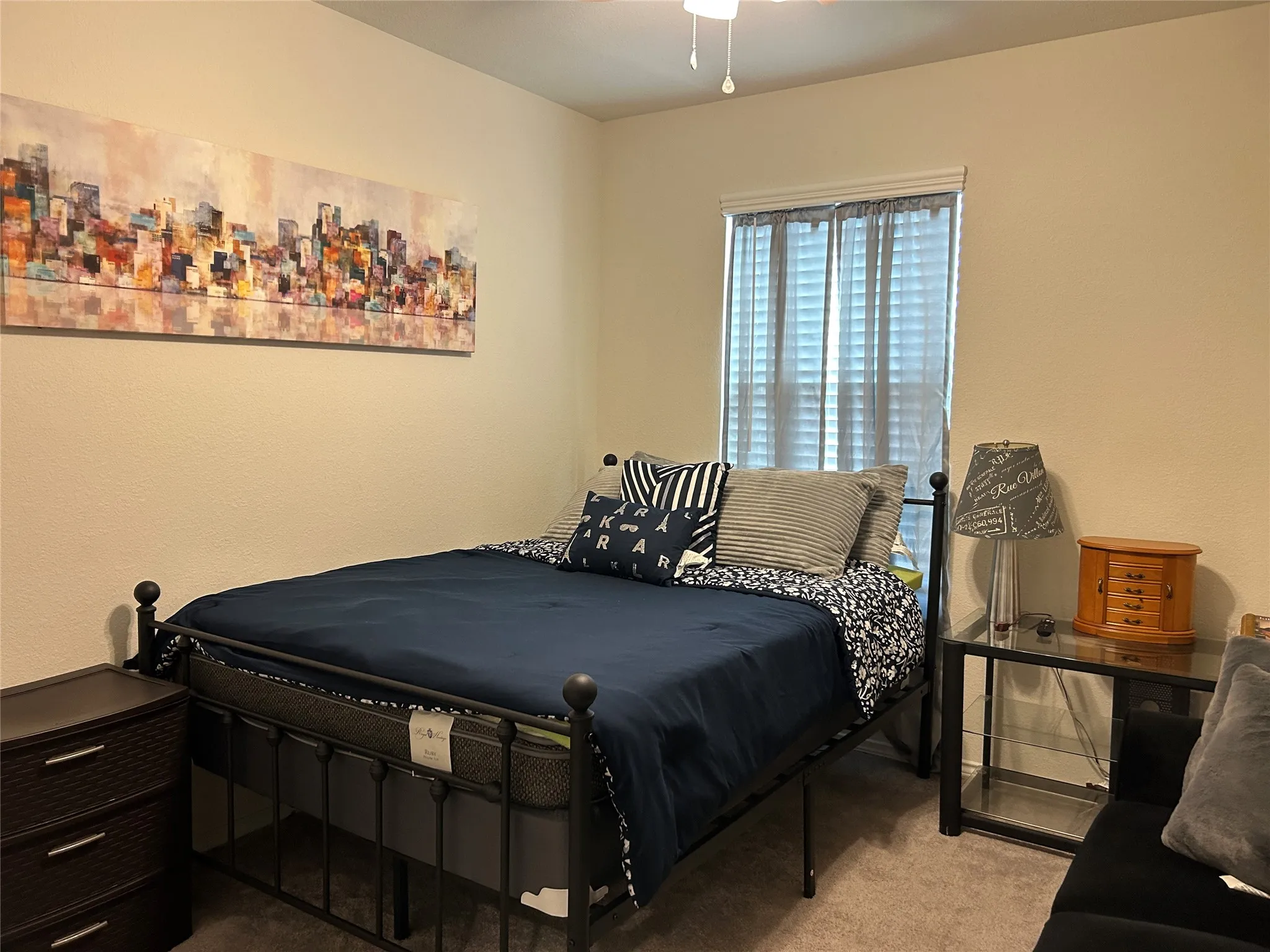 Bedroom featuring light carpet