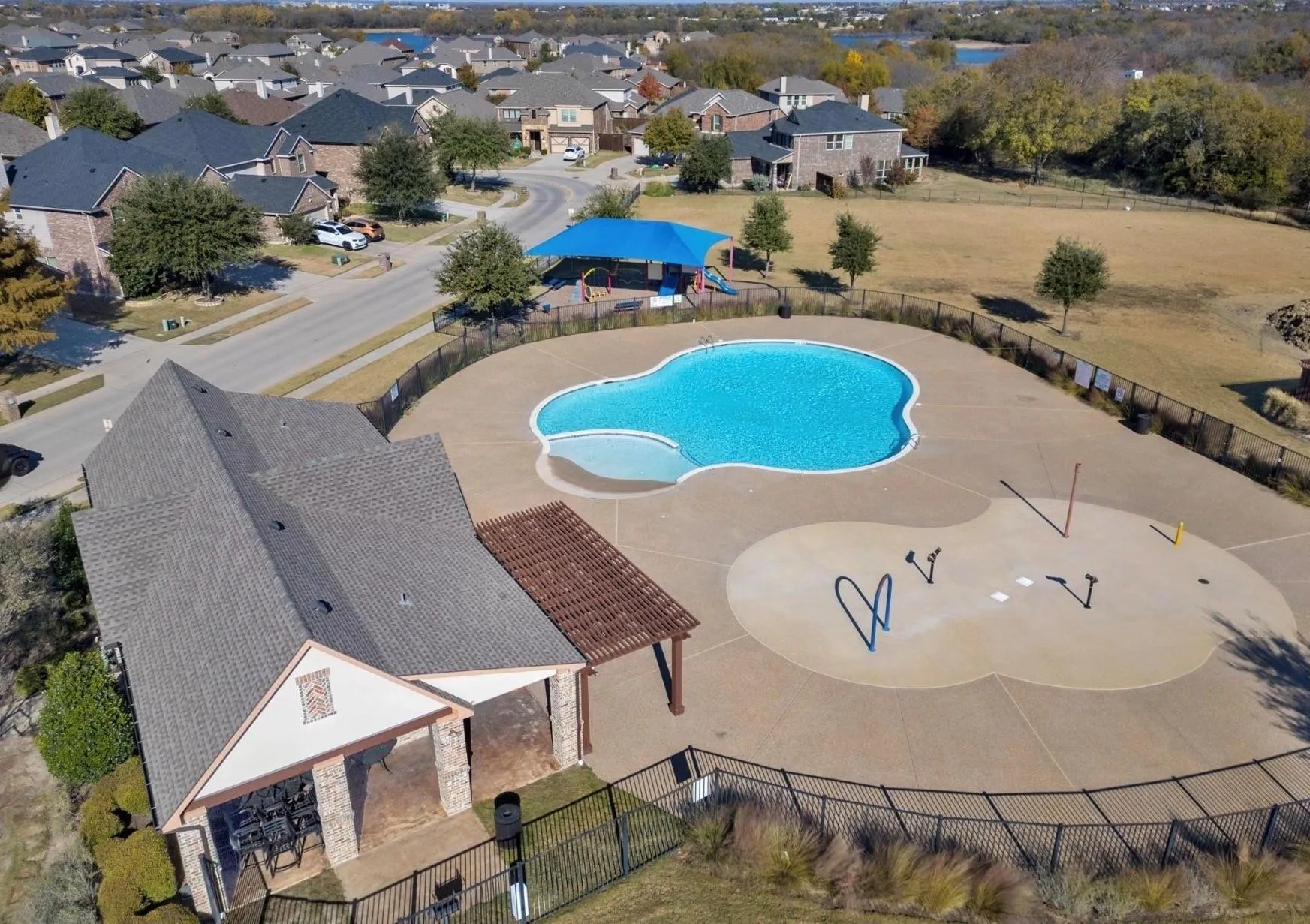 Community pool featuring a residential view