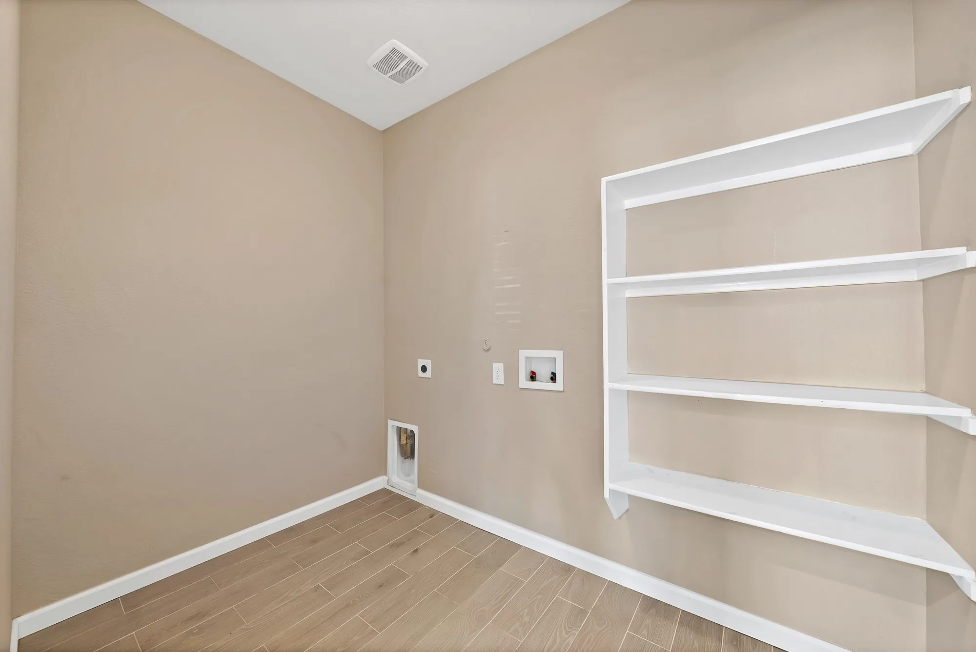 Laundry room with electric dryer hookup, wood tiled floors, washer hookup, and gas dryer hookup