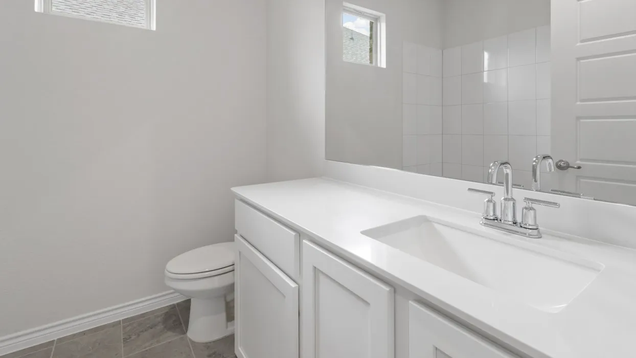 Bathroom with vanity and baseboards