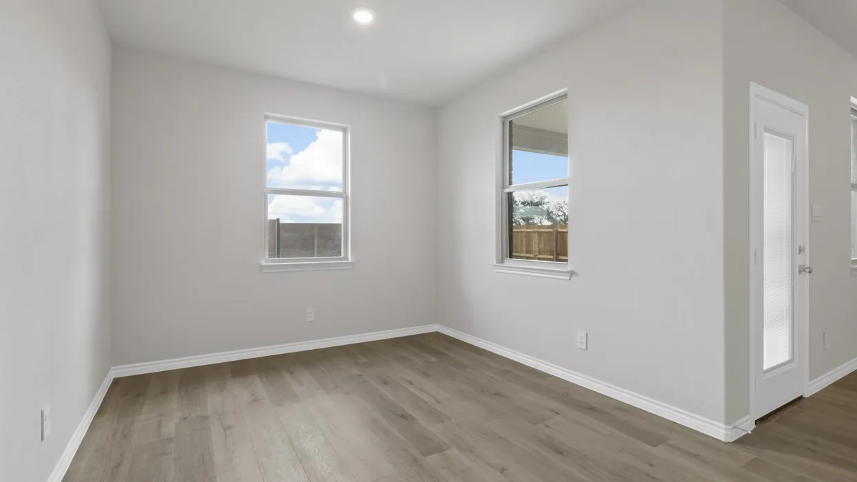 Spare room with light wood-style flooring, plenty of natural light, and recessed lighting