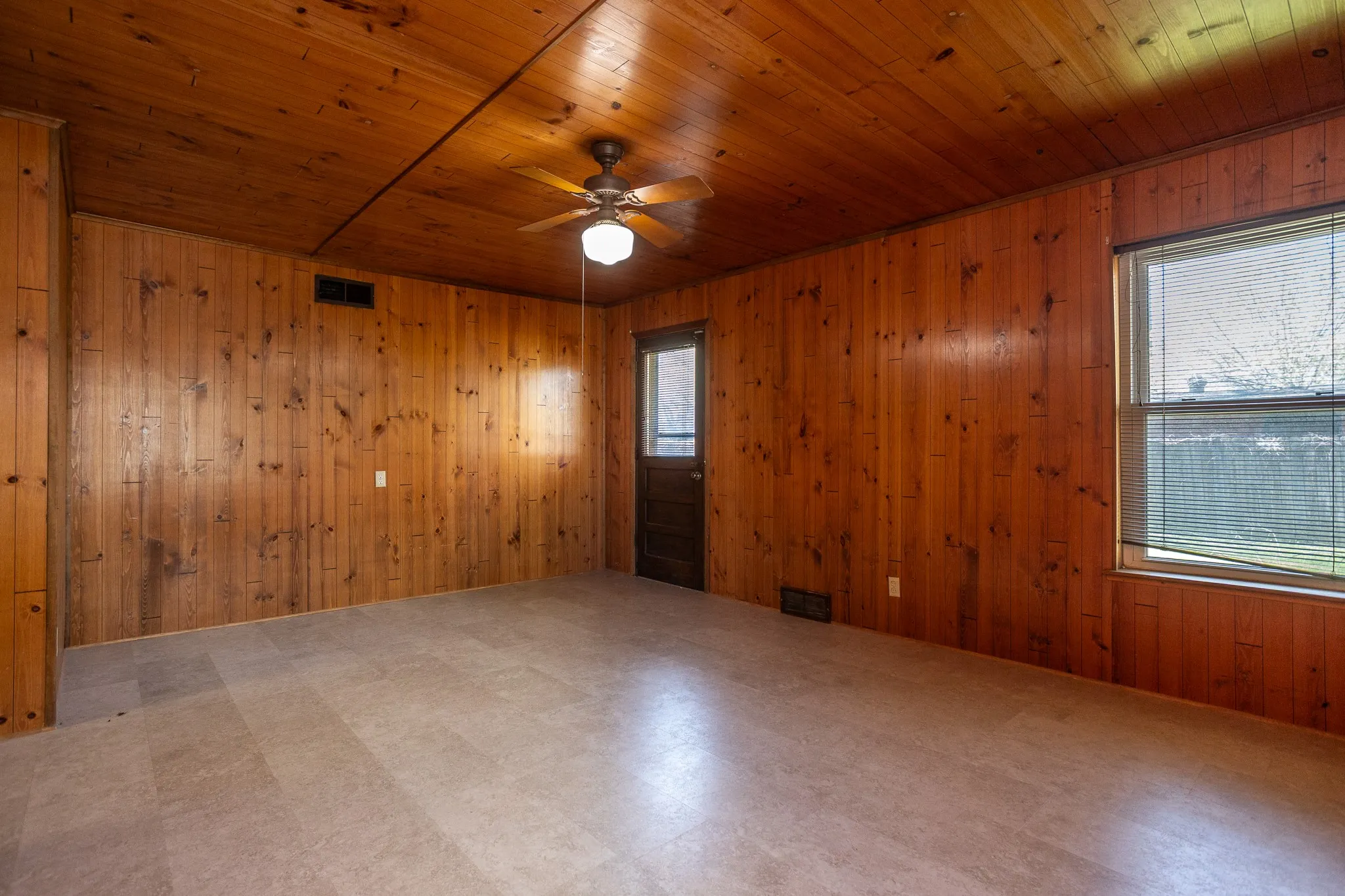 Knotted pine walls, walk in closet area in the back bedroom with outside entrance.