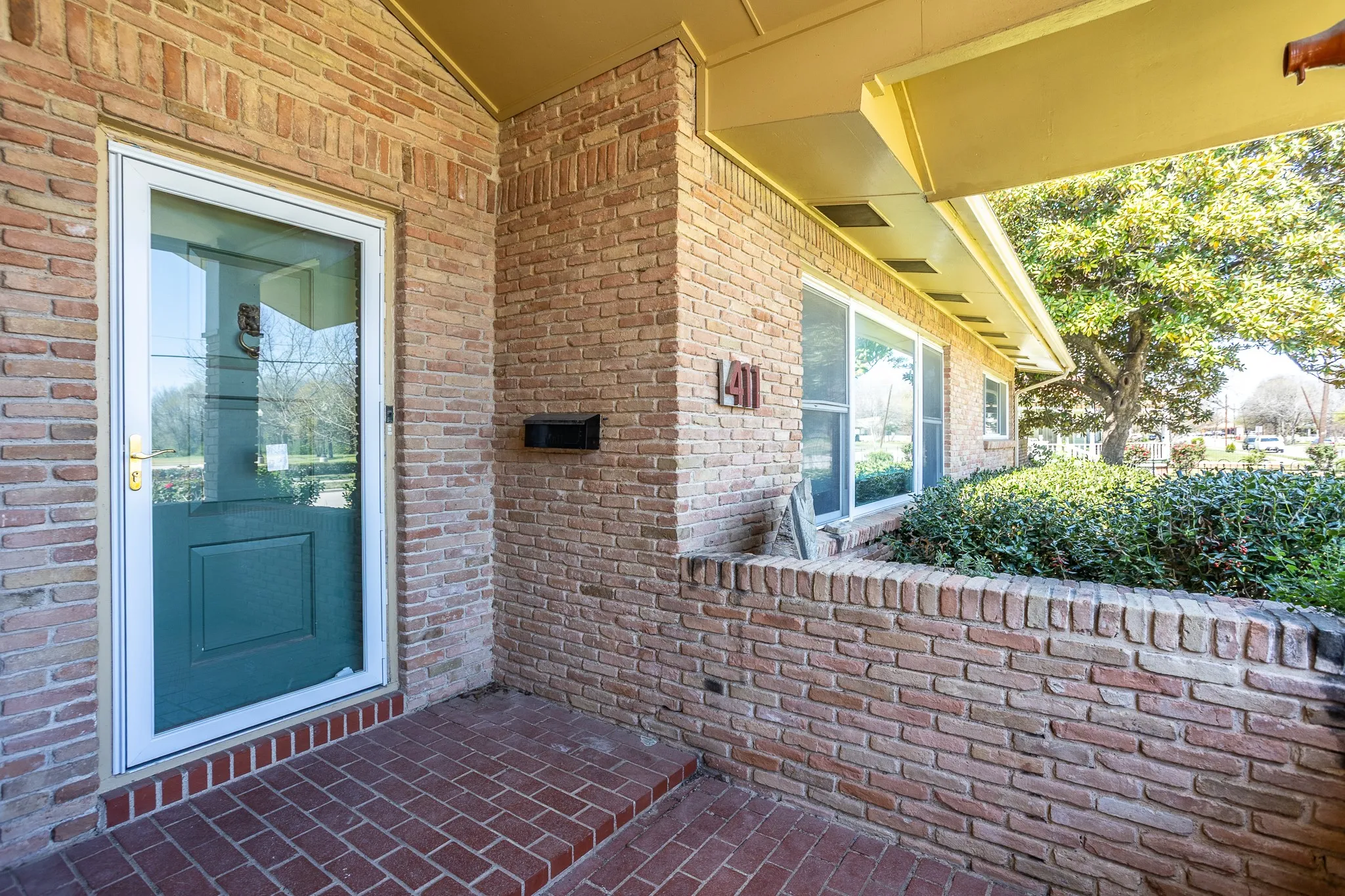 Front entry is brick with several levels like big steps.