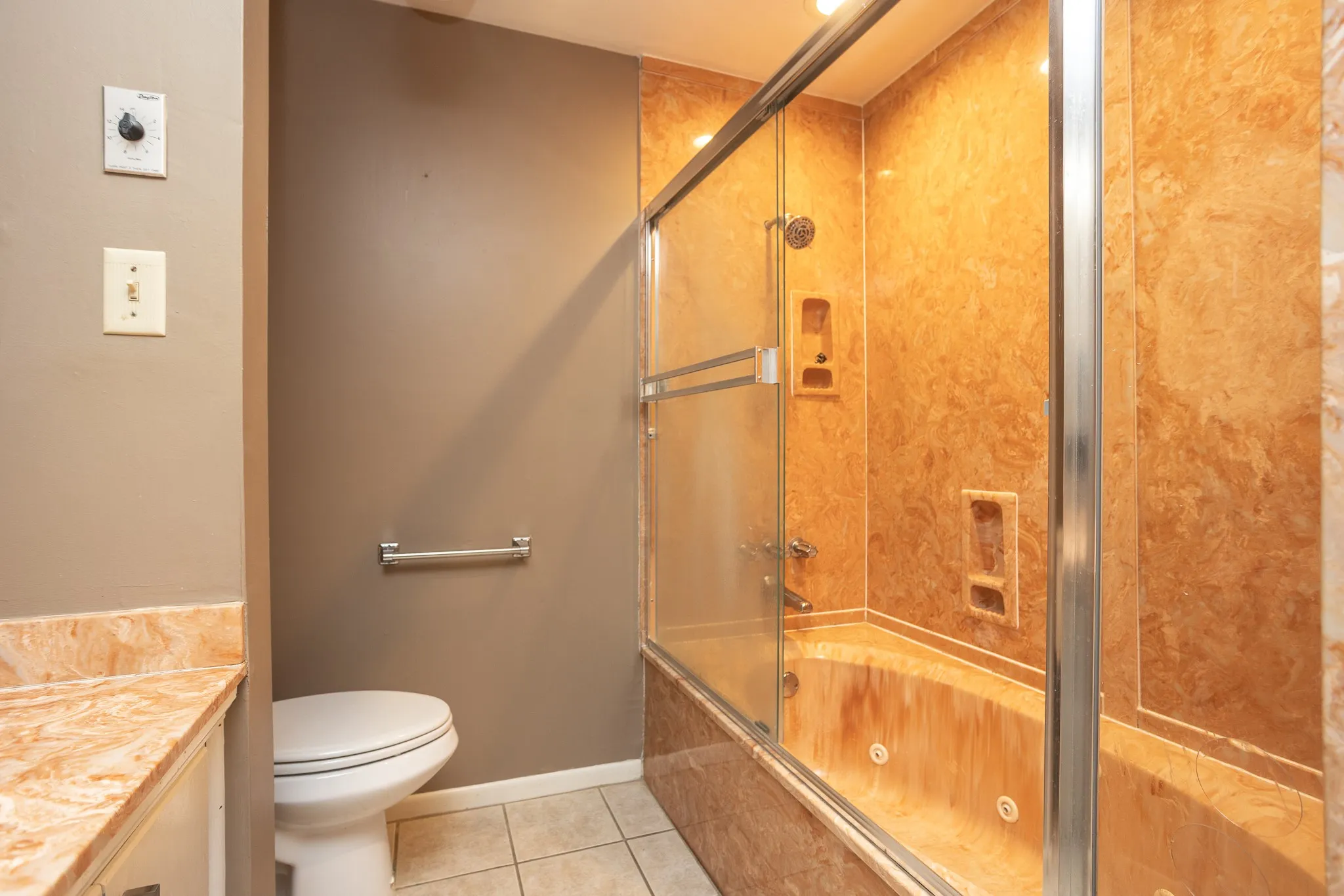 Master bath has tub shower combo
