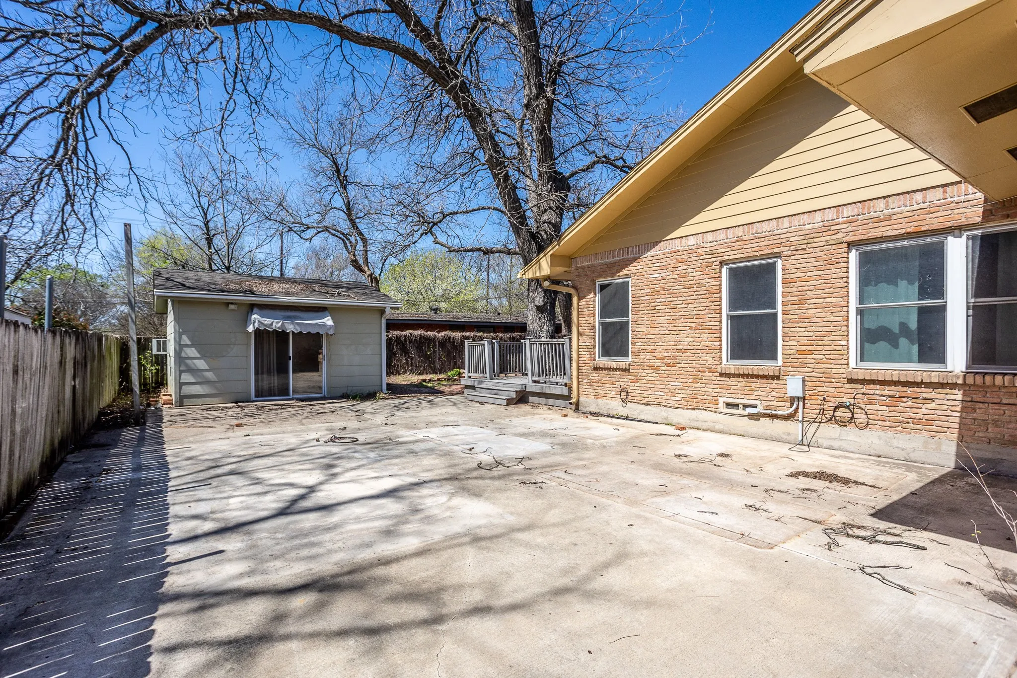 As you enter side gate there is secured concrete to park cars, boats, or little kids riding trikes.  16x16 she shed could be exercise room with heat & air.