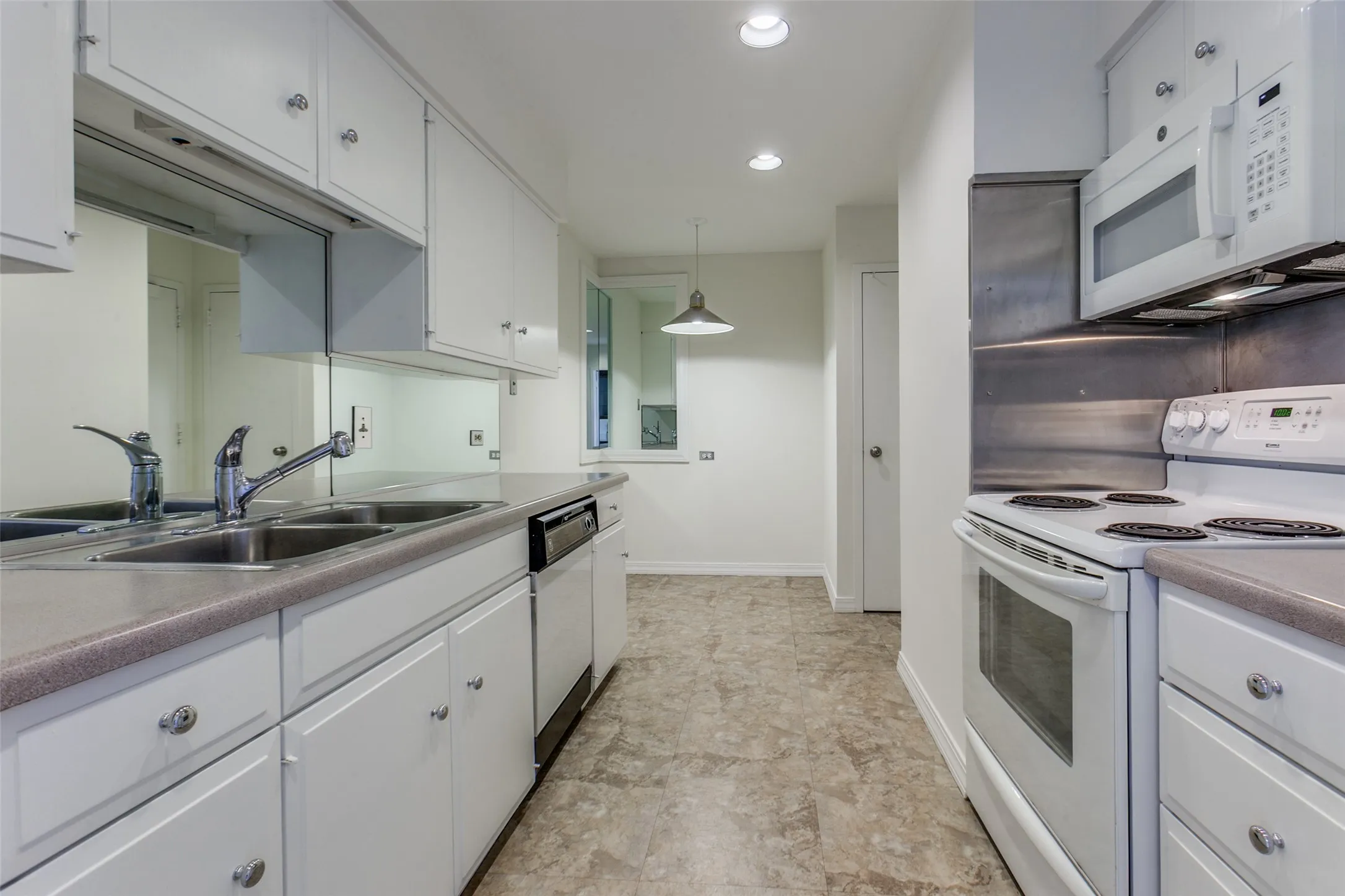 Kitchen with breakfast area. The back door is off the kitchen.