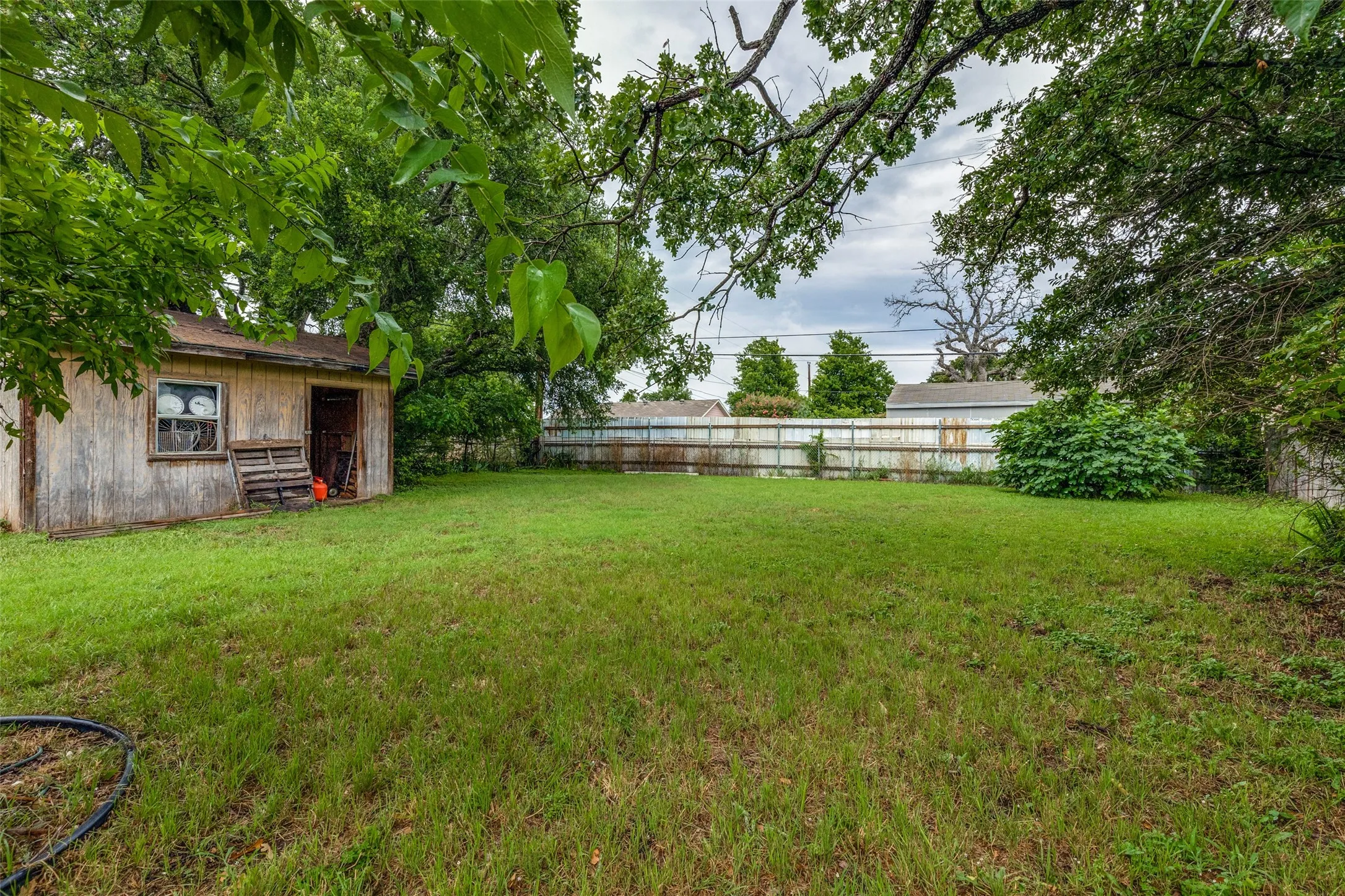 View of fenced backyard