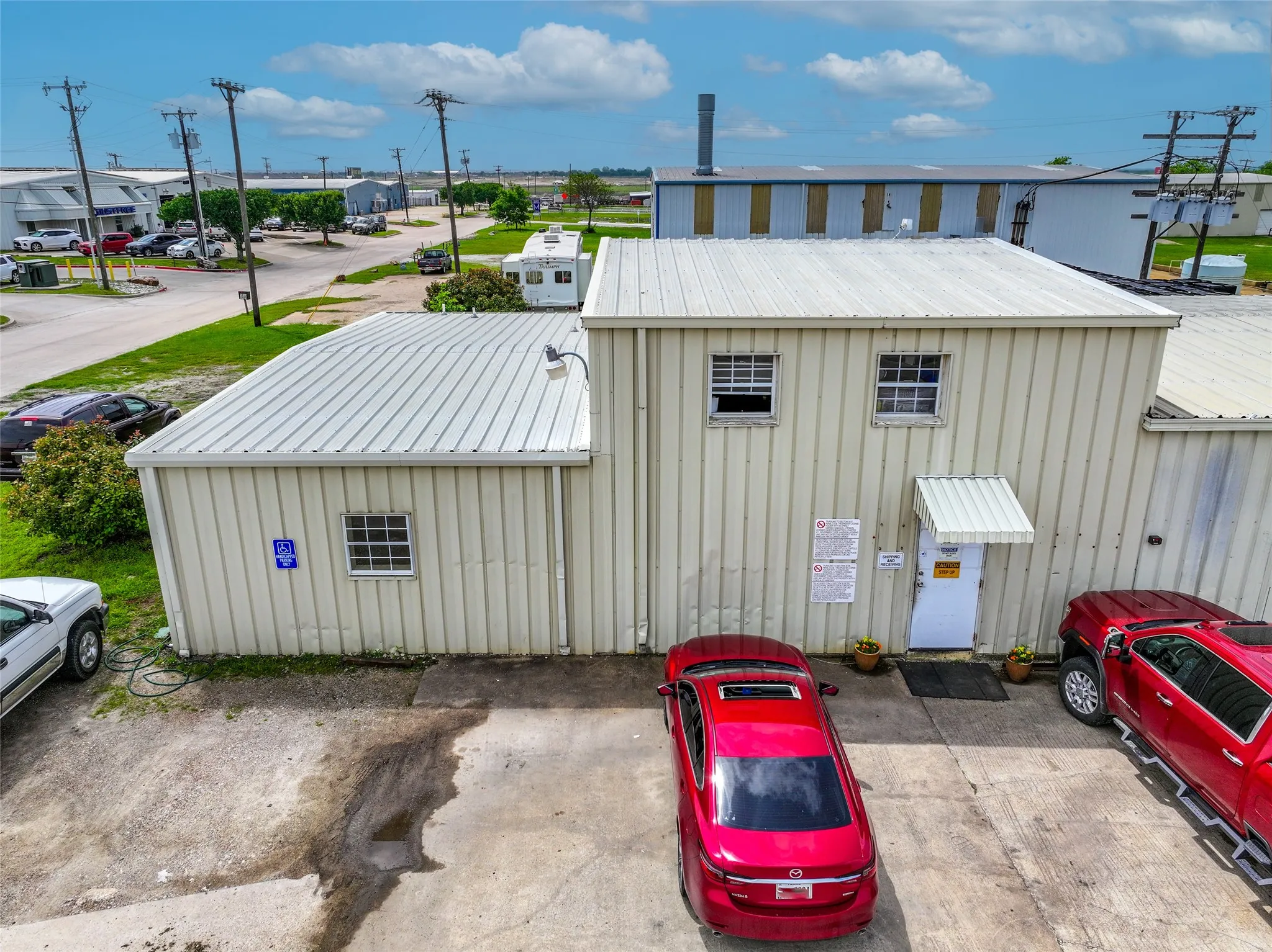 View of outdoor commercial structure and parking