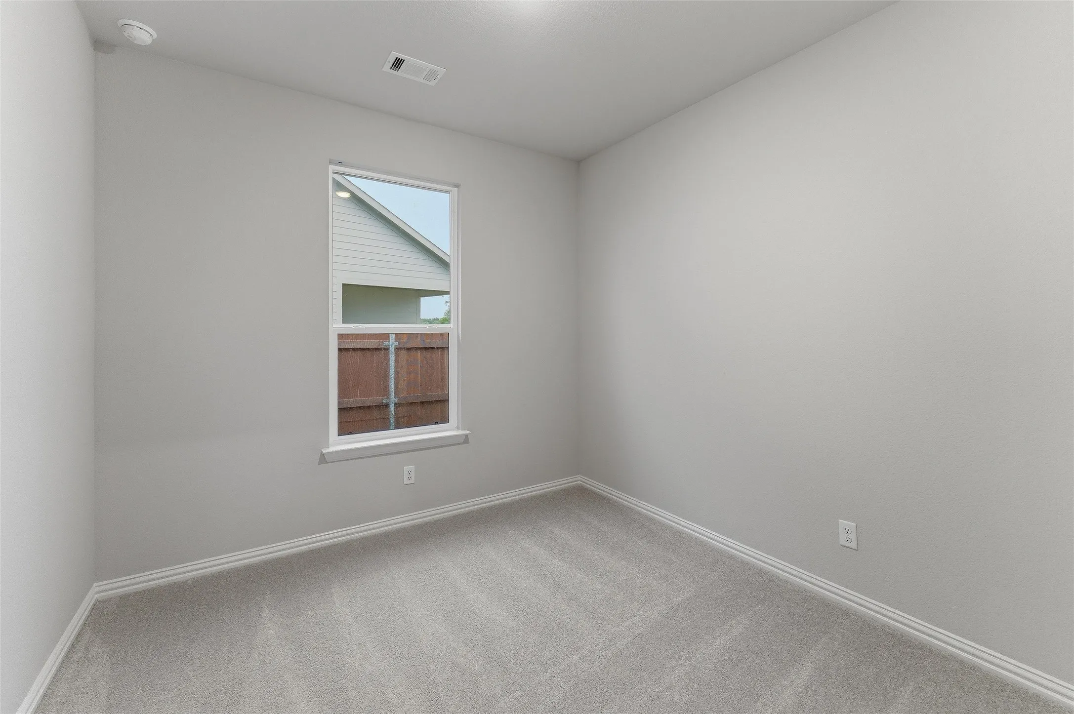 Neutral gray walls complementing light gray carpeting