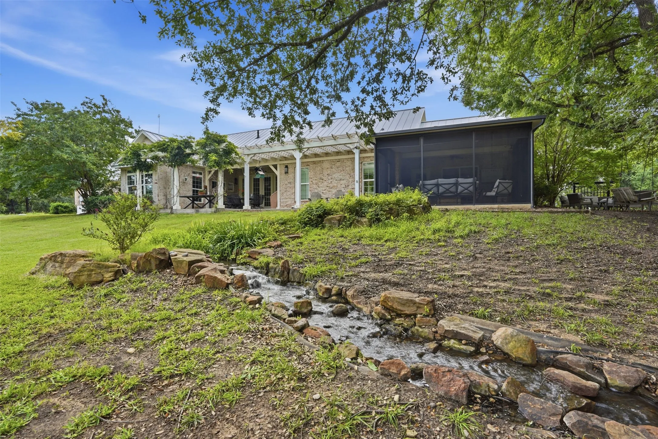 Water feature off the back patio that feeds into the creek, into the lake.