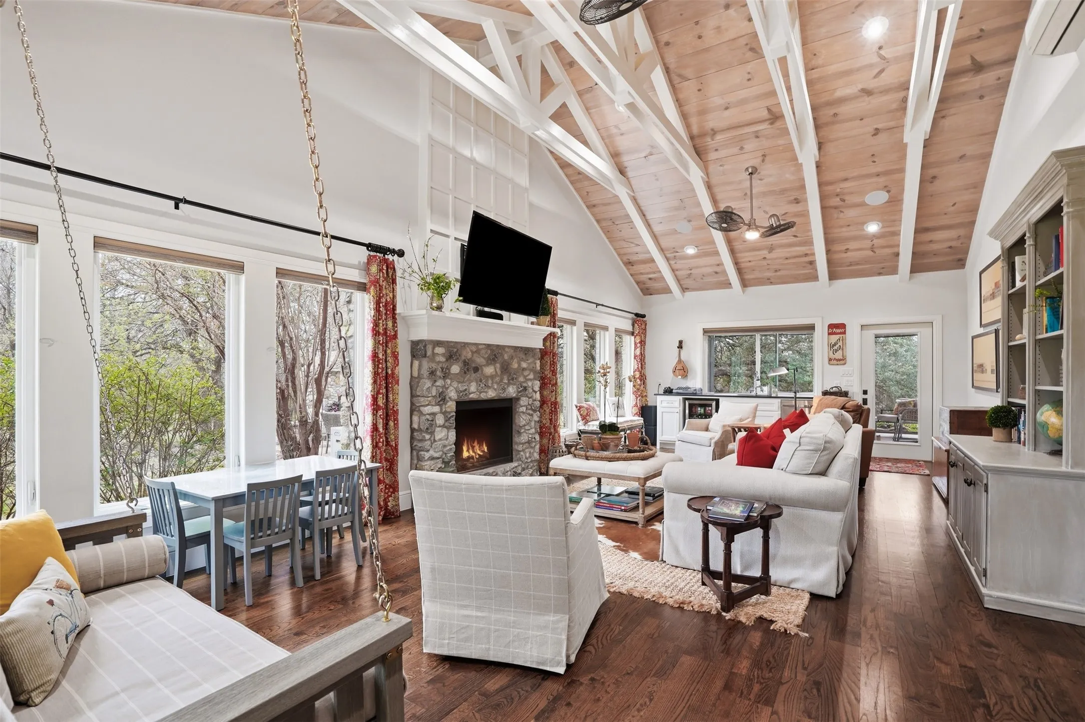 Zoned seperately with a wall AC unit, sliding window over bartop, door outside to screened in patio with outdoor kitchen.