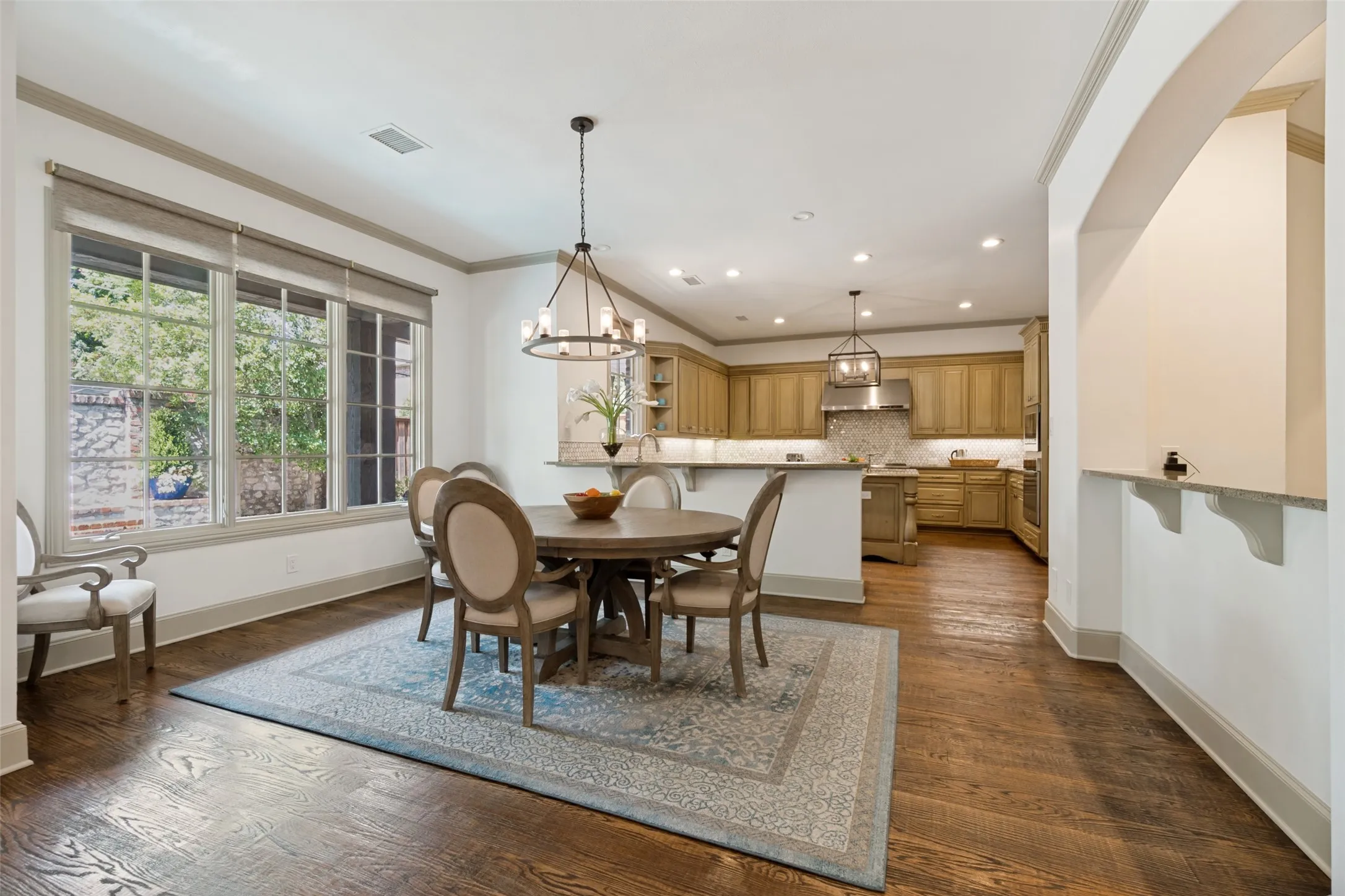 The breakfast room enjoys large casement windows that let in an abundance of natural light.