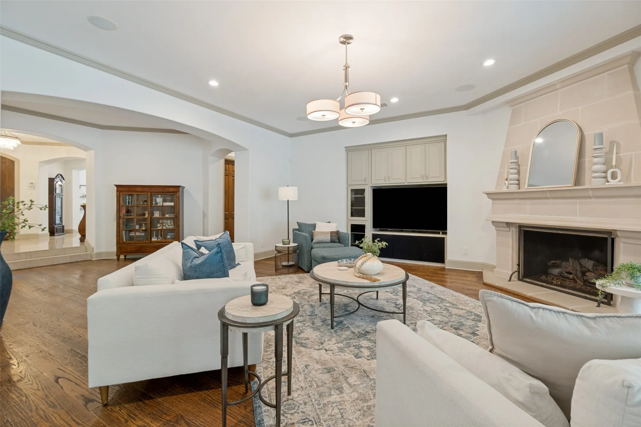 A cozy fireplace and built in entertainment system.