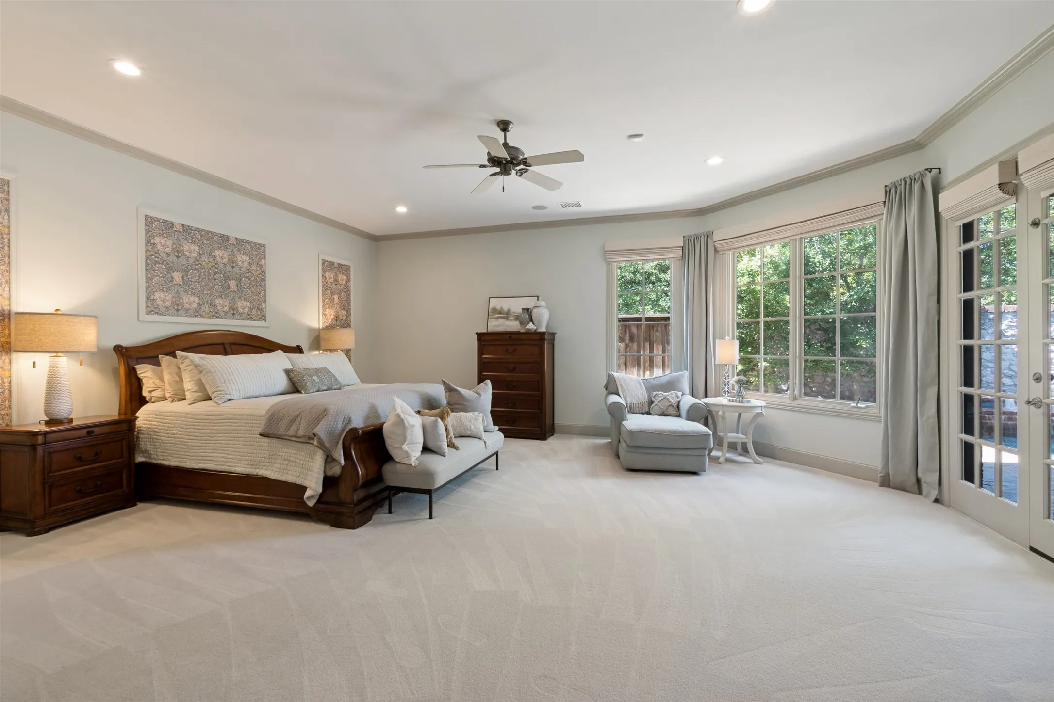 The generous and private master suite enjoys views and direct access to the heated pool. Large casement windows and french doors provide an abundance of natural light. The custom wall panels can be personalized. The carpet is ultra plush underofoot.