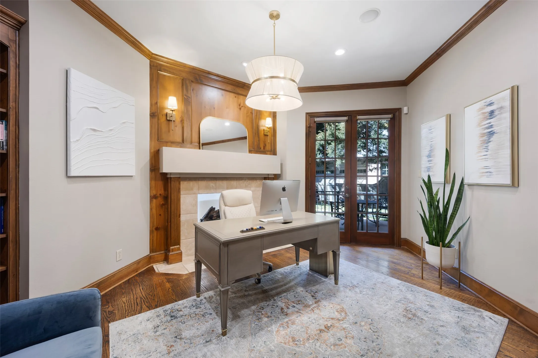 Handsome library with built-ins, fireplace and private terrace just through the french doors.