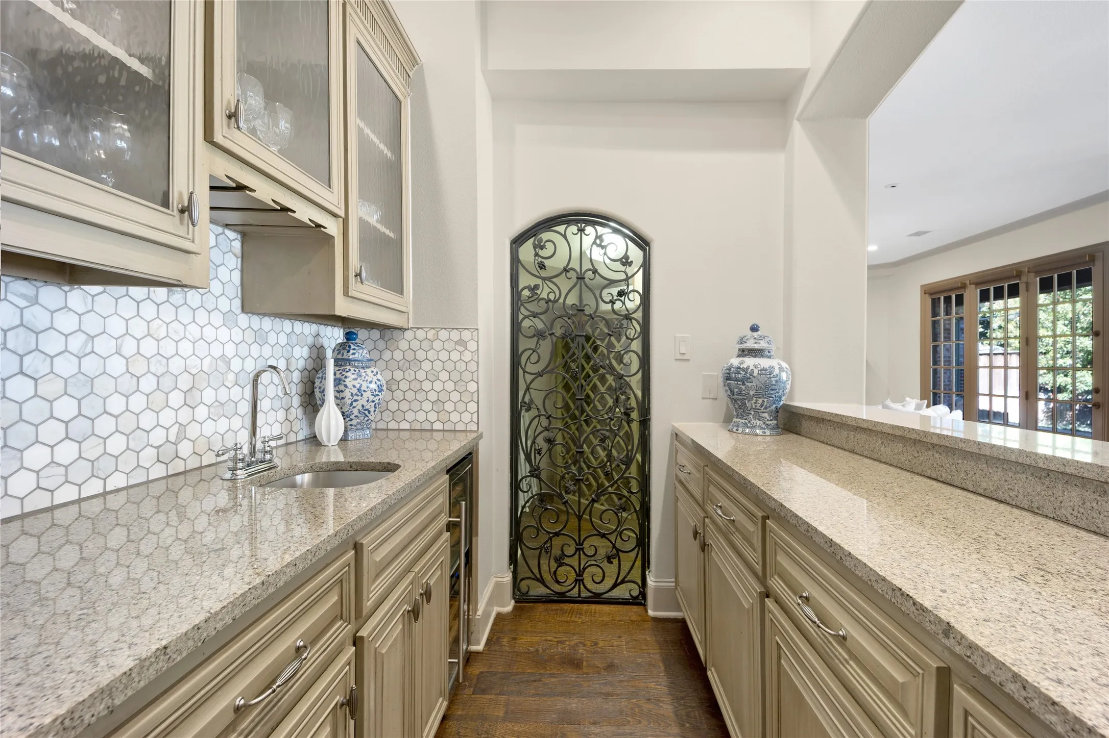The wet bar has a chilled wine fridge and wine room with storage for your favorite vintages.