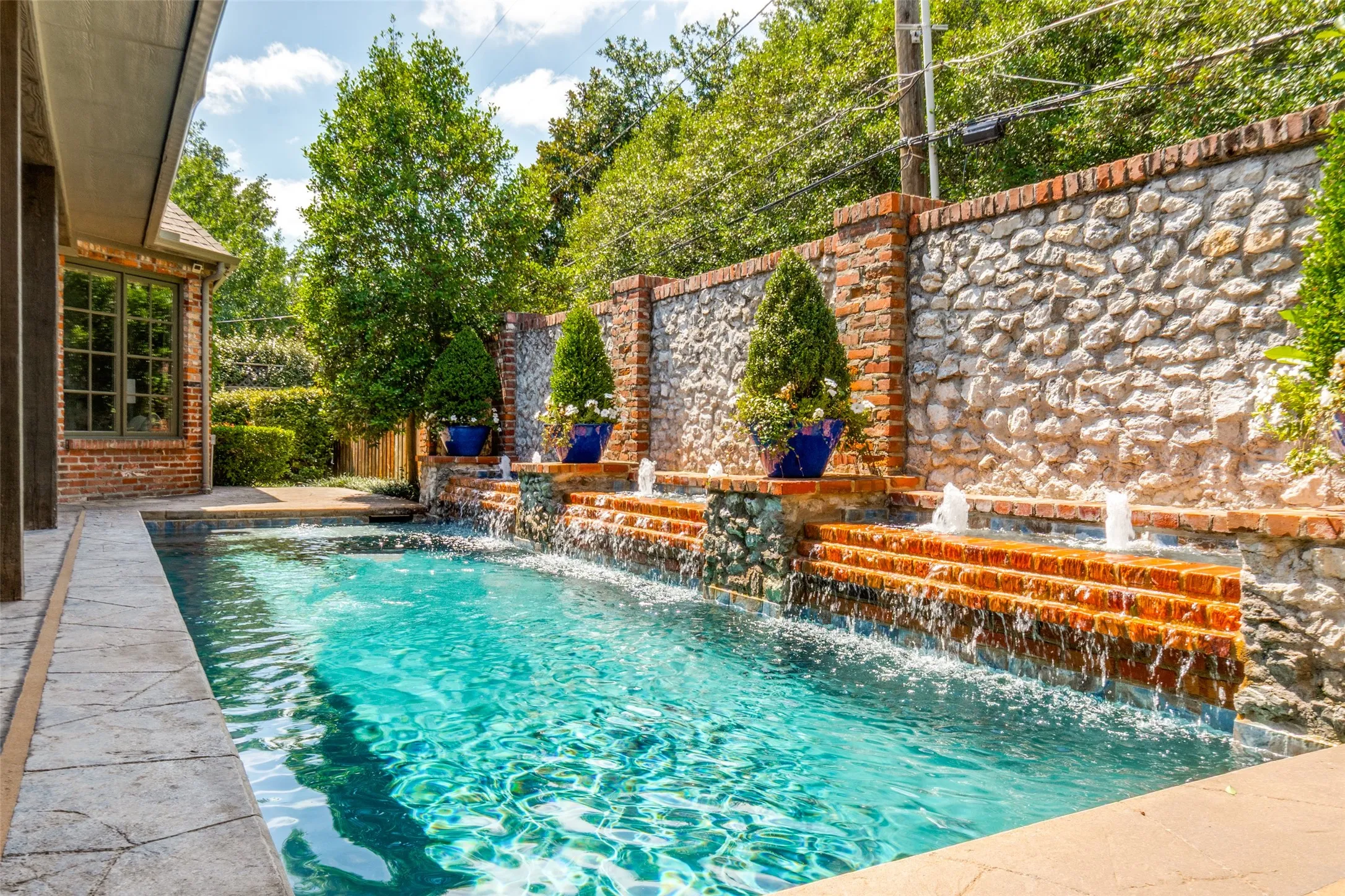 The current owners replaced the tile and the plaster, added a heater stained the deck and added pergola and outdoor kitchen. All work and maintained weekly by Miller's Pools