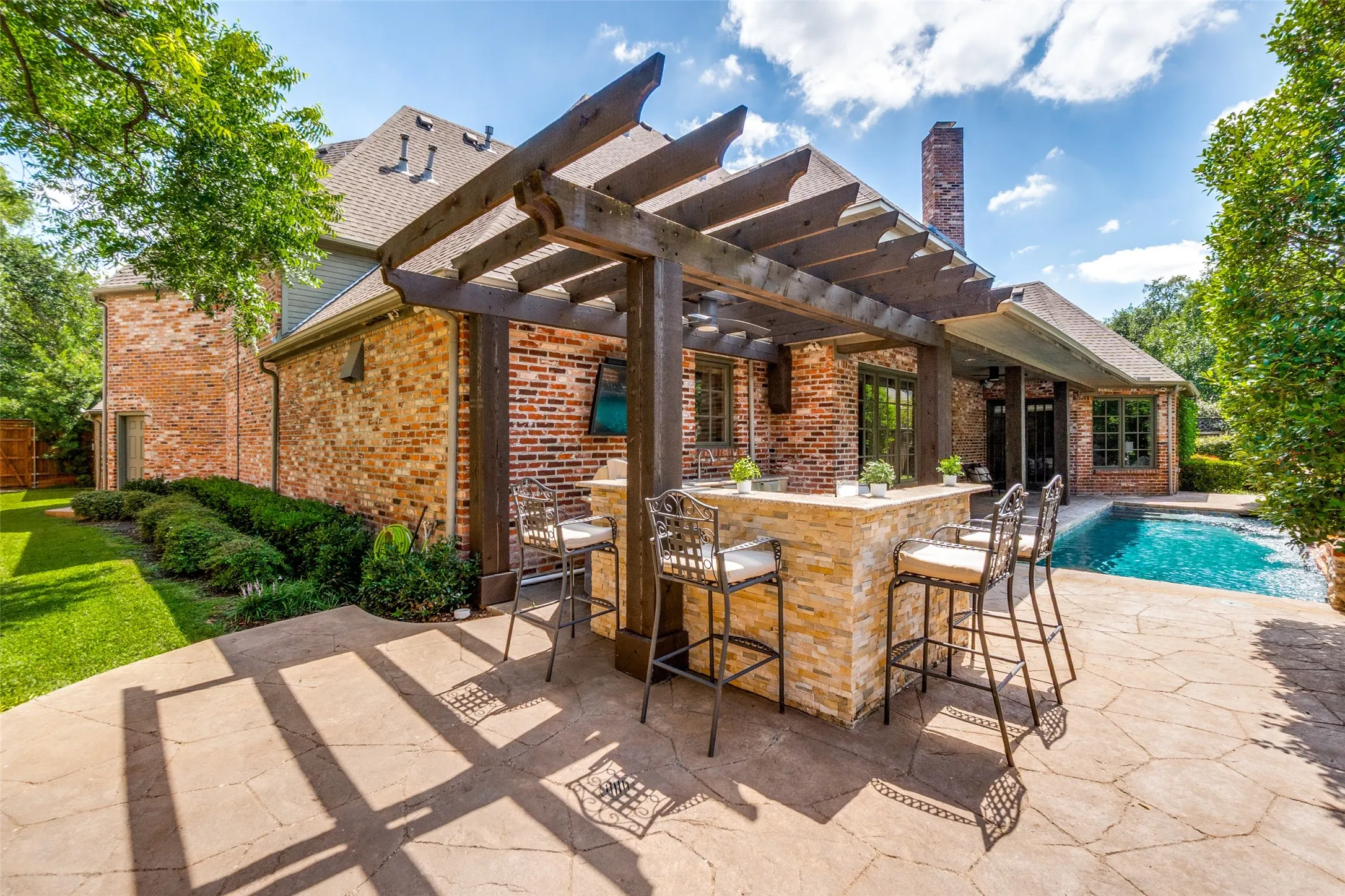 Entertaining has never been more fun than grilling poolside while catching the game. Relax by the pool and enjoy the sounds of the three pool fountains. The heated pool can be enjoyed year round and accessed directly from the 1st floor primary suite.