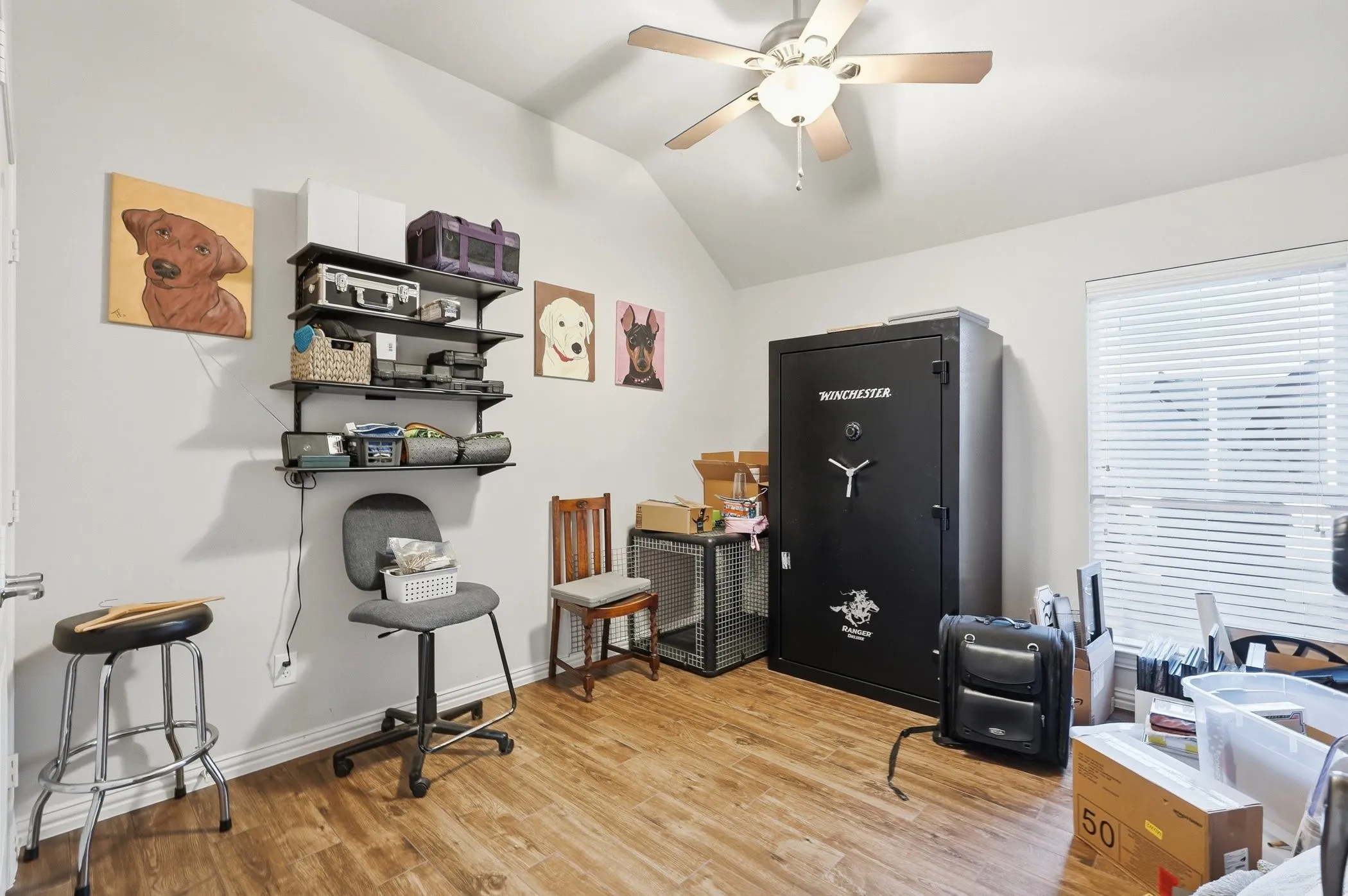 Office featuring vaulted ceiling, light wood-type flooring, and a ceiling fan