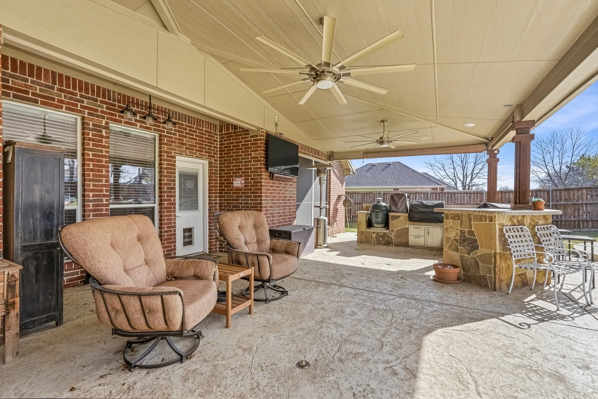 View of patio / terrace with a ceiling fan and an outdoor kitchen