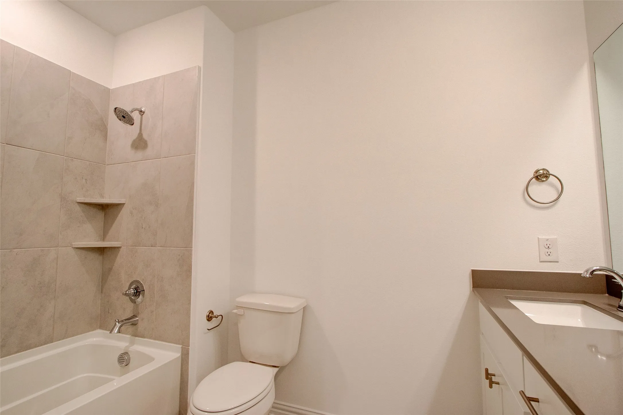 Bathroom with vanity and shower / bath combination