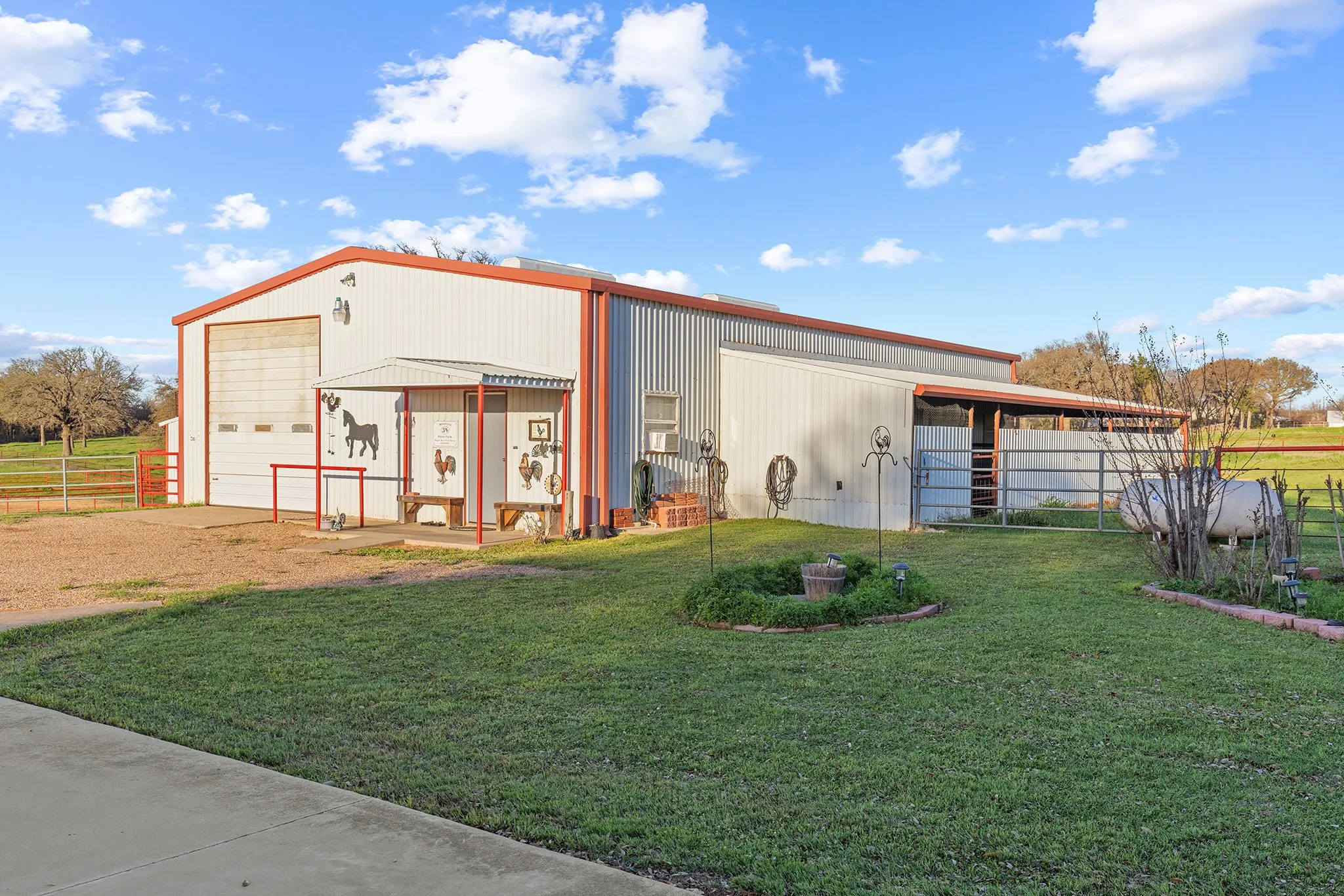 View of outbuilding with driveway and an exterior structure