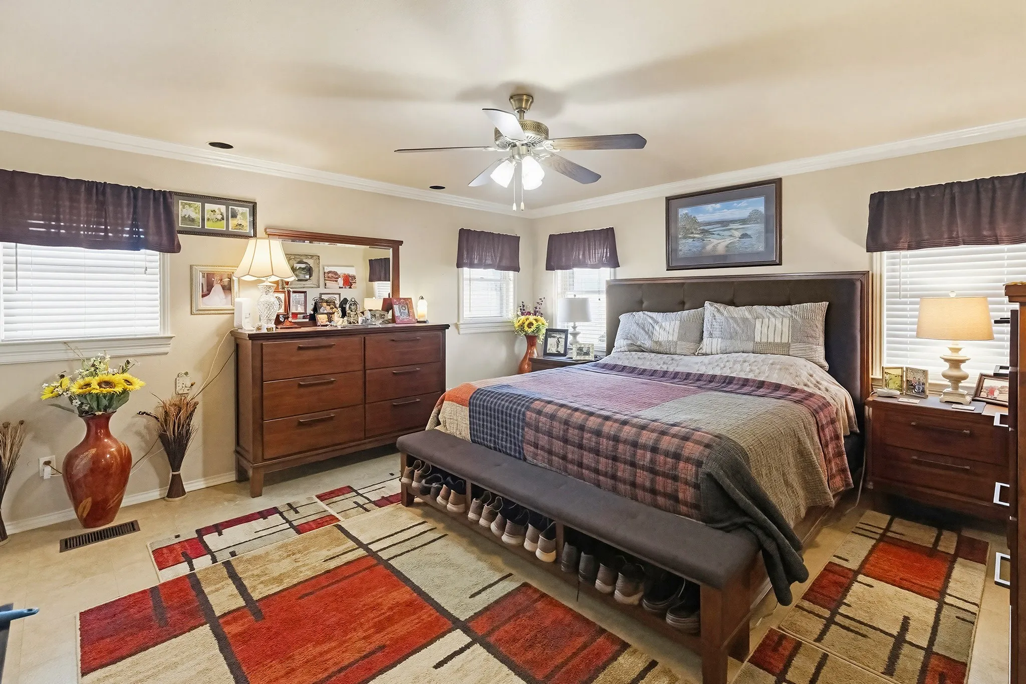 Bedroom with crown molding and a ceiling fan