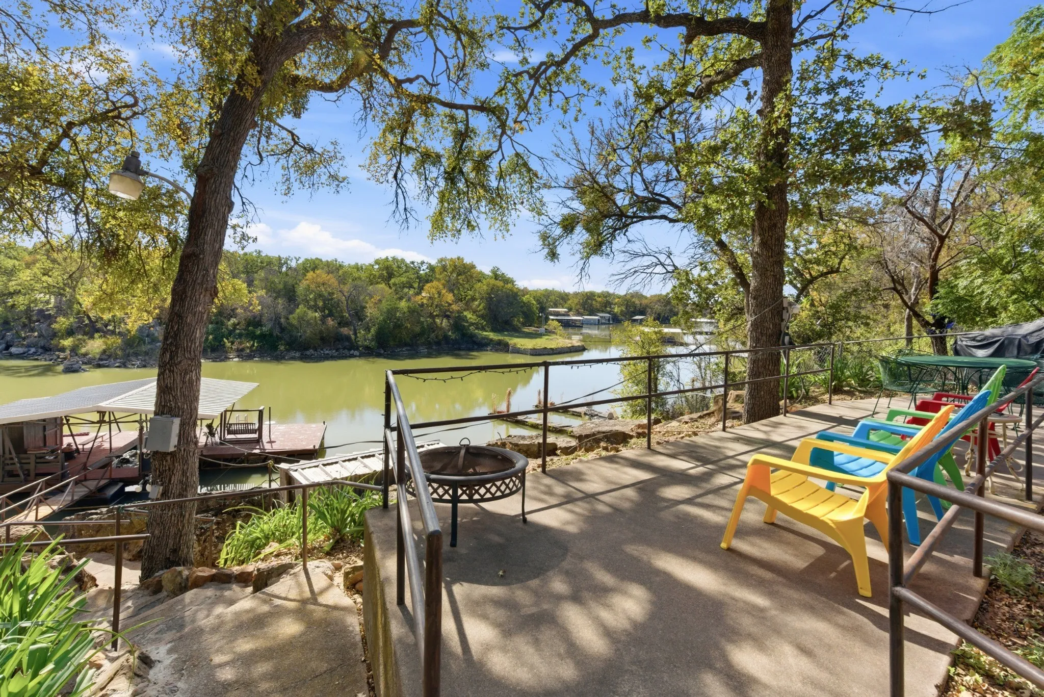 Multiple outdoor sitting areas overlook the water