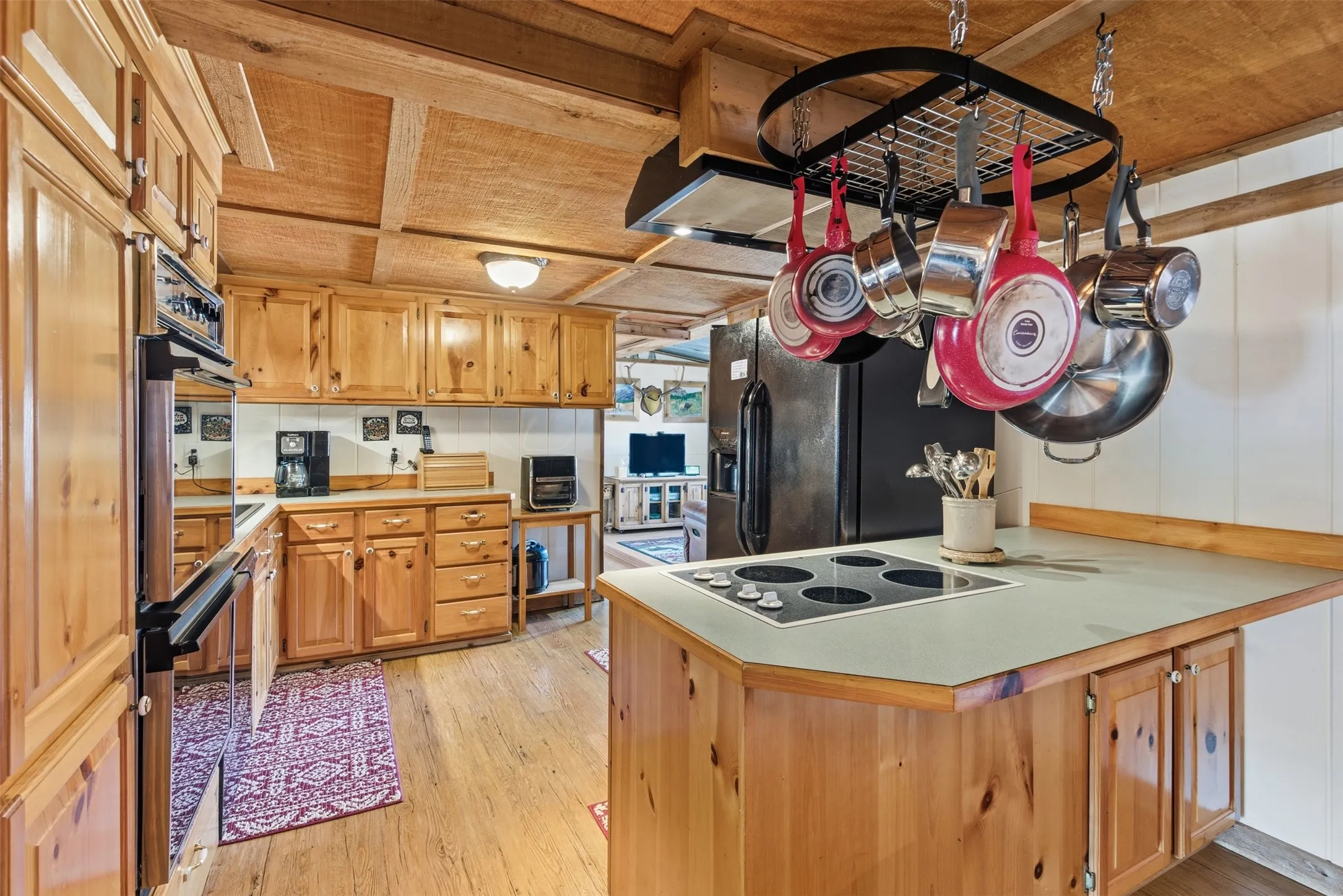 Kitchen island offers additional workspace, storage and casual seating.