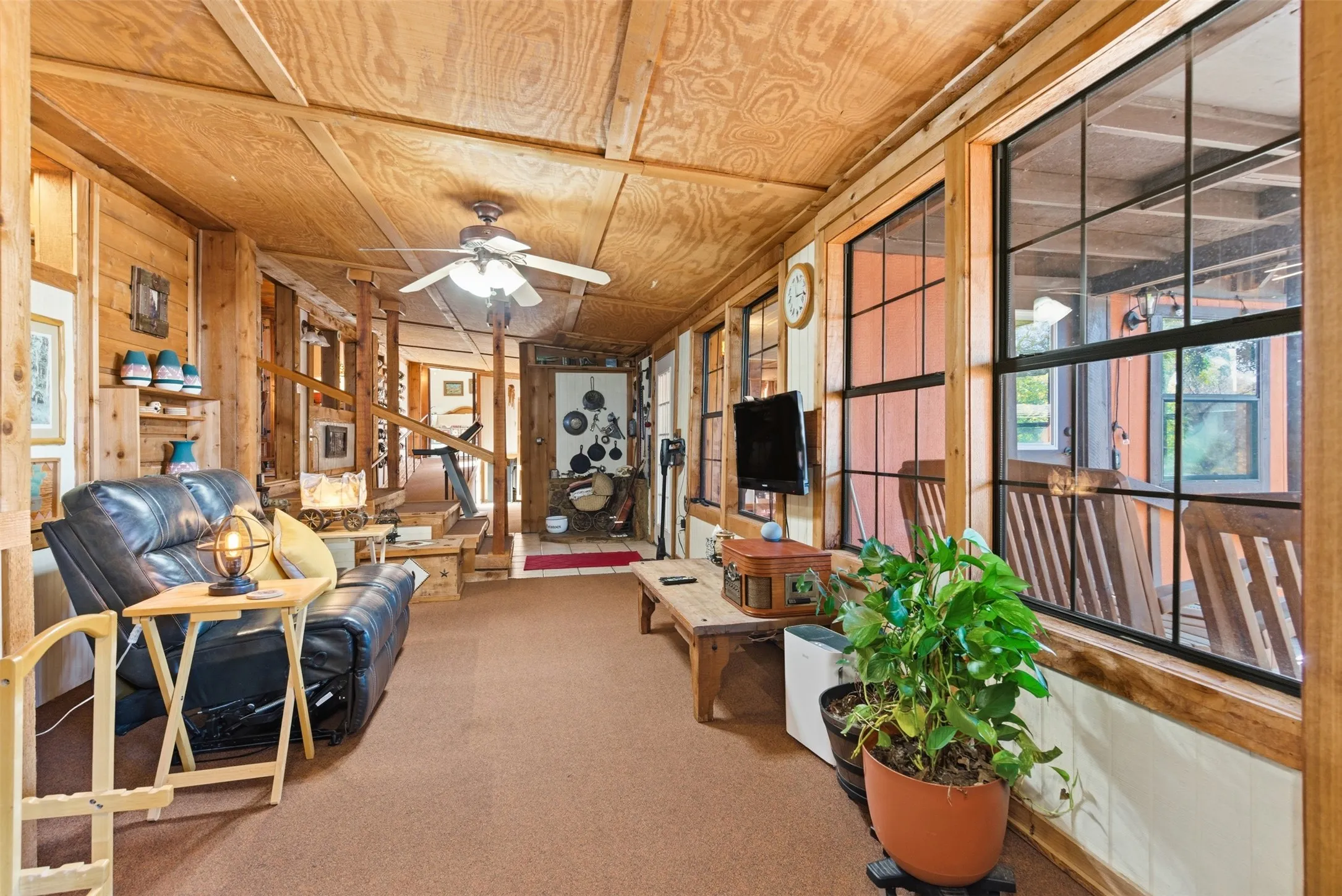 Spacious family room with abundant windows overlooking the lake.