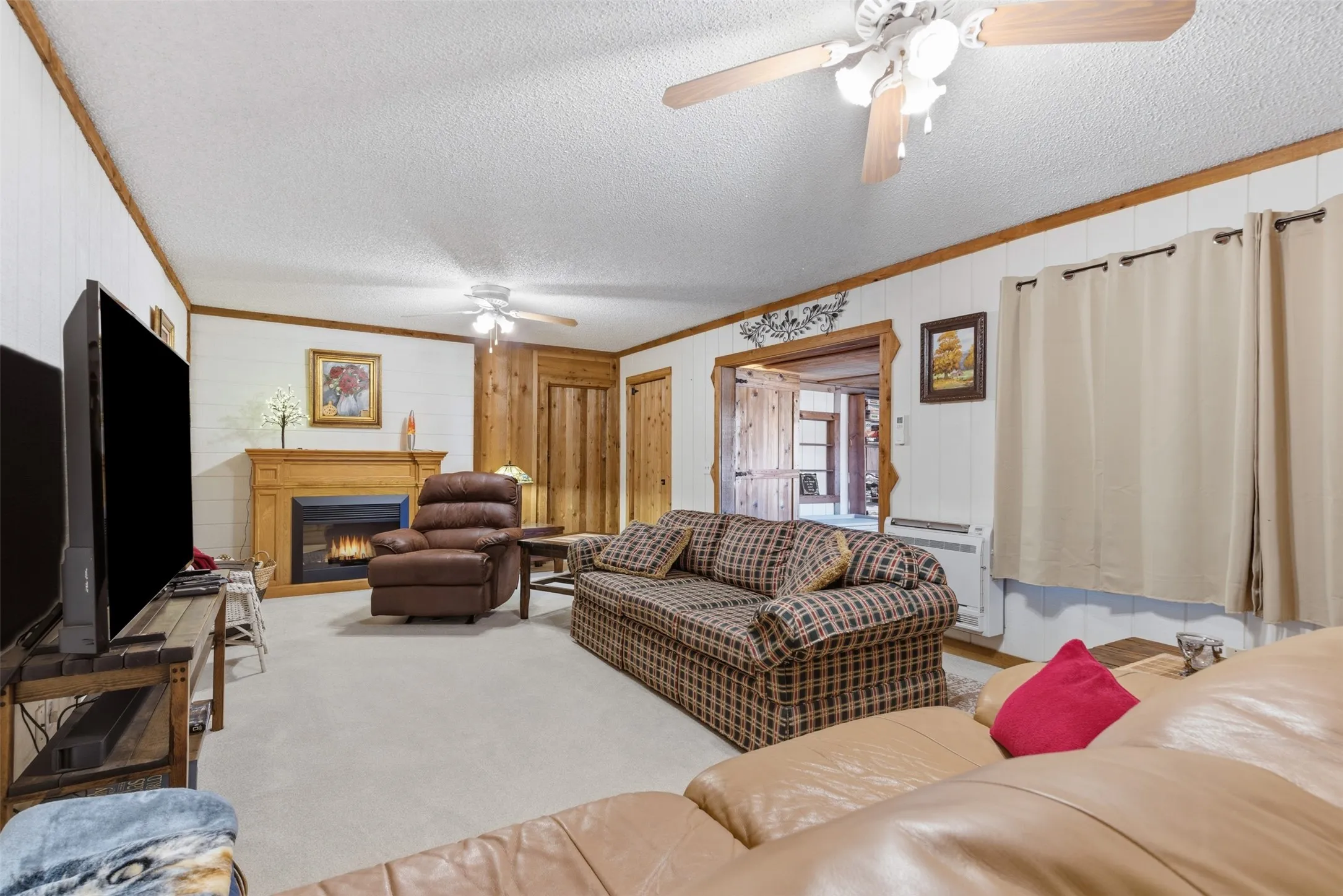 Large living room offers plenty of space for gathering and entertaining.