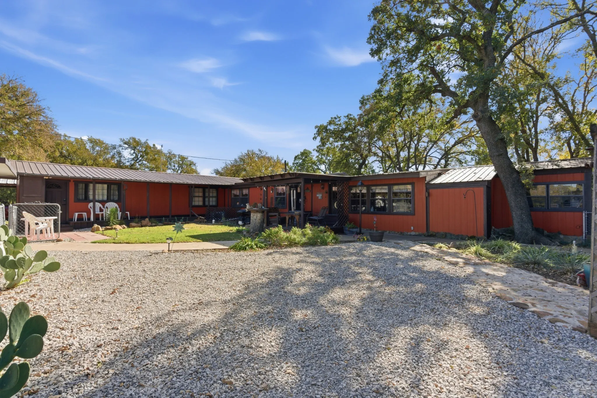 Daytime exterior view of the extensively expanded residence.
