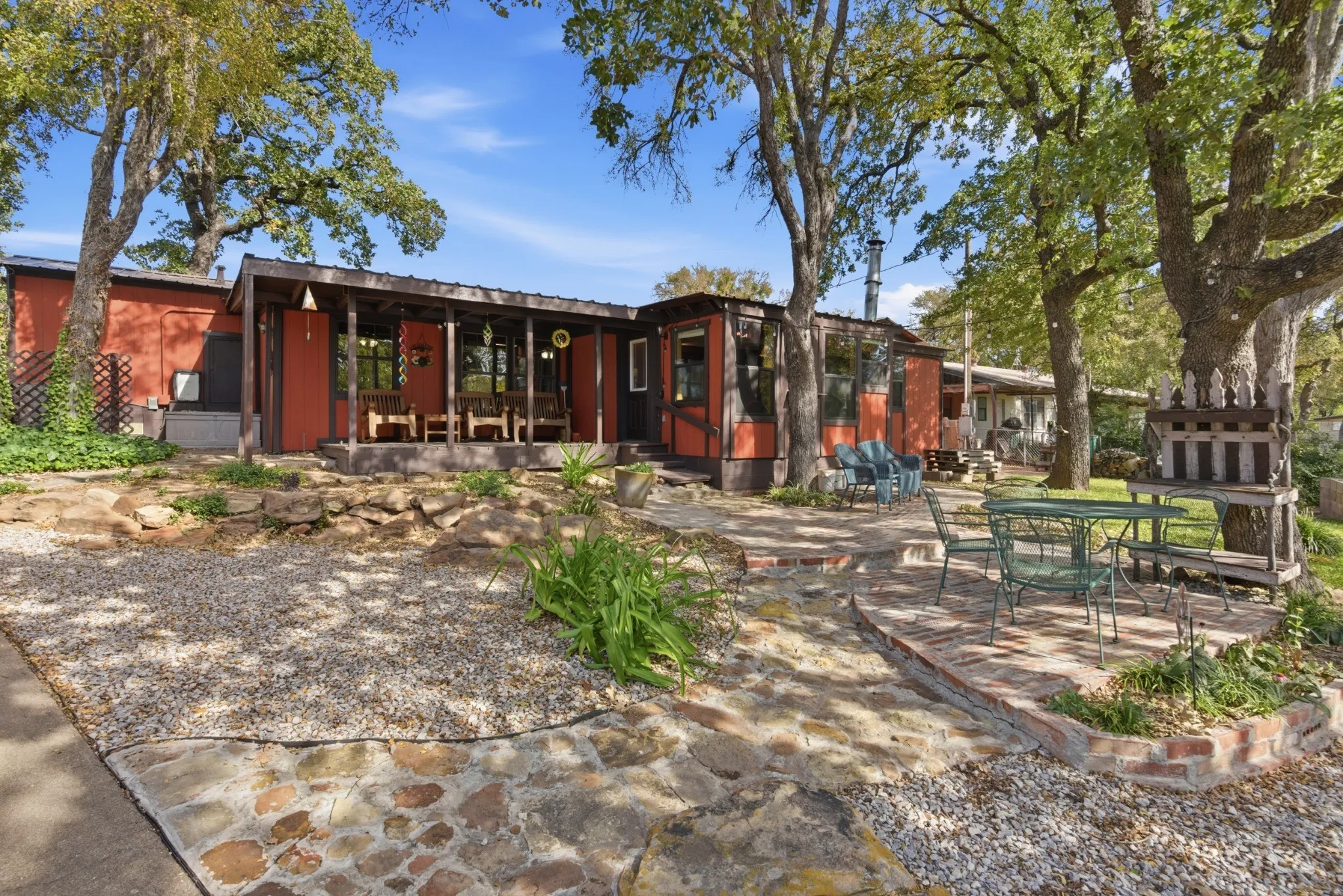 Outdoor living areas beneath mature shade trees.