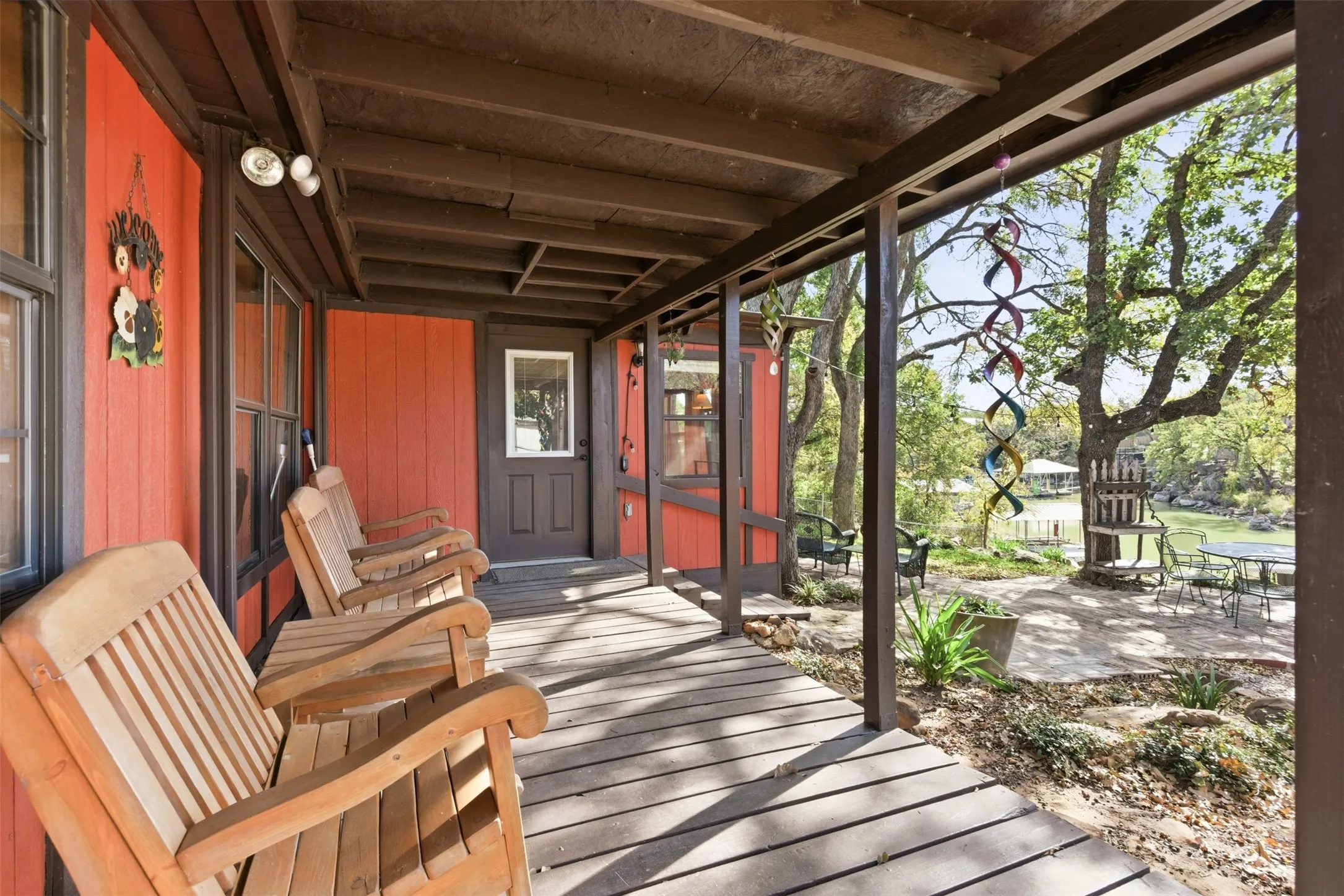Covered porch provides a shaded outdoor retreat.