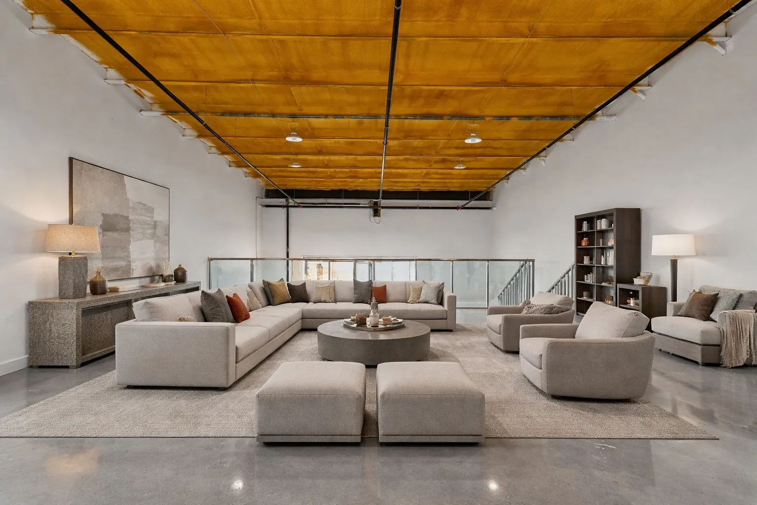Living area with finished concrete floors and wood ceiling