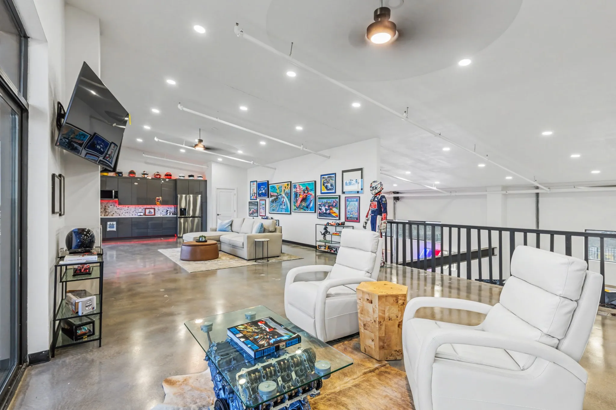 Living room featuring ceiling fan, finished concrete flooring, recessed lighting, and vaulted ceiling