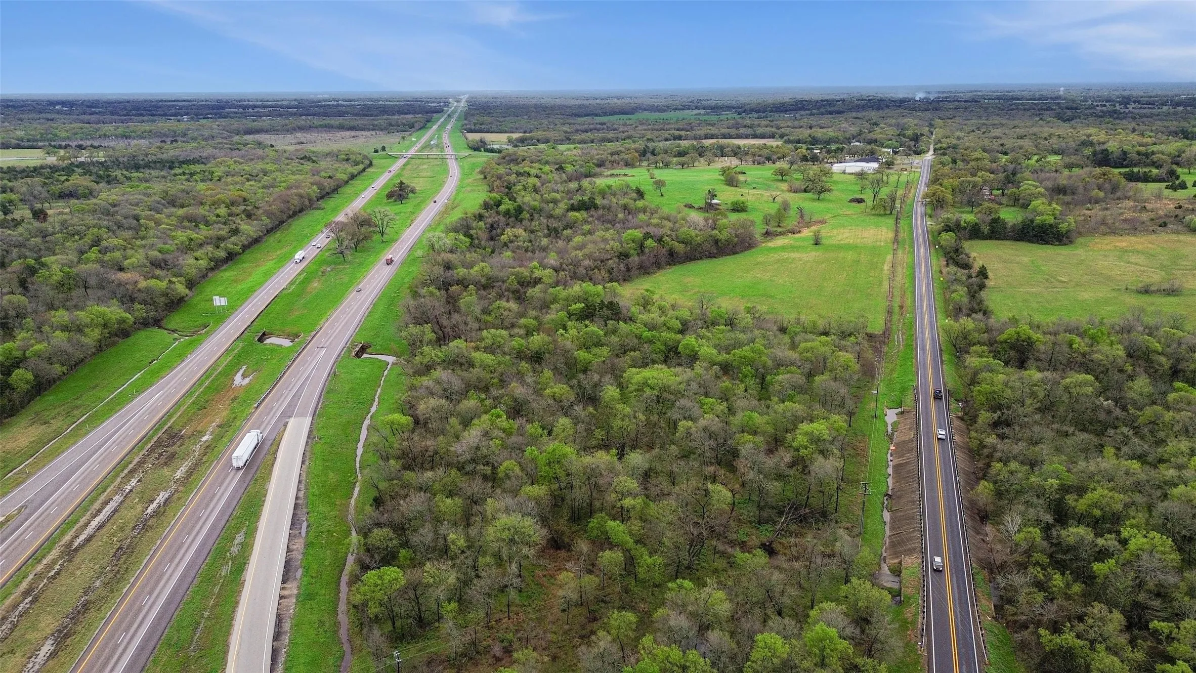 Aerial view of a highway and a forest