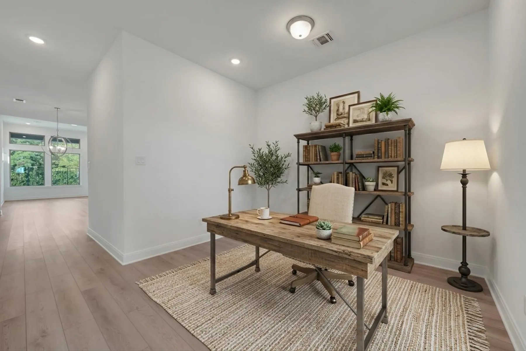 Recessed and flush mount ceiling lighting, wood-finish flooring, and white walls