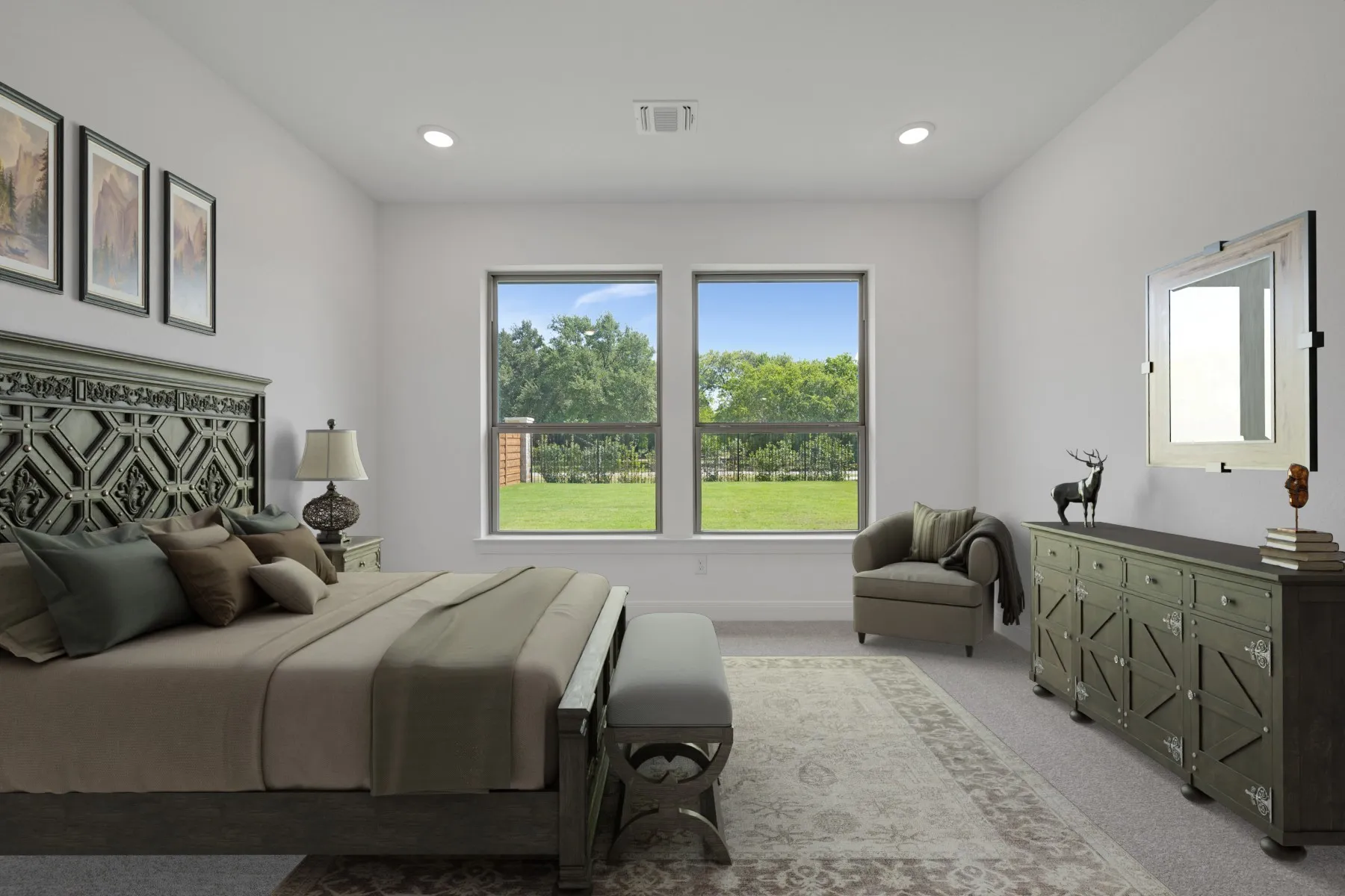 Spacious primary bedroom showcasing dual glass doors opening to manicured grounds, geometric patterned upholstered headboard, neutral bedding, recessed ceiling lighting, large dresser with mirror, and abundant natural light from expansive windows framing verdant landscape views