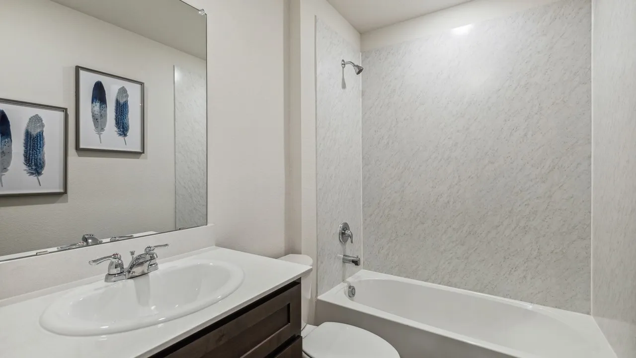 Bathroom featuring vanity and shower / bath combination