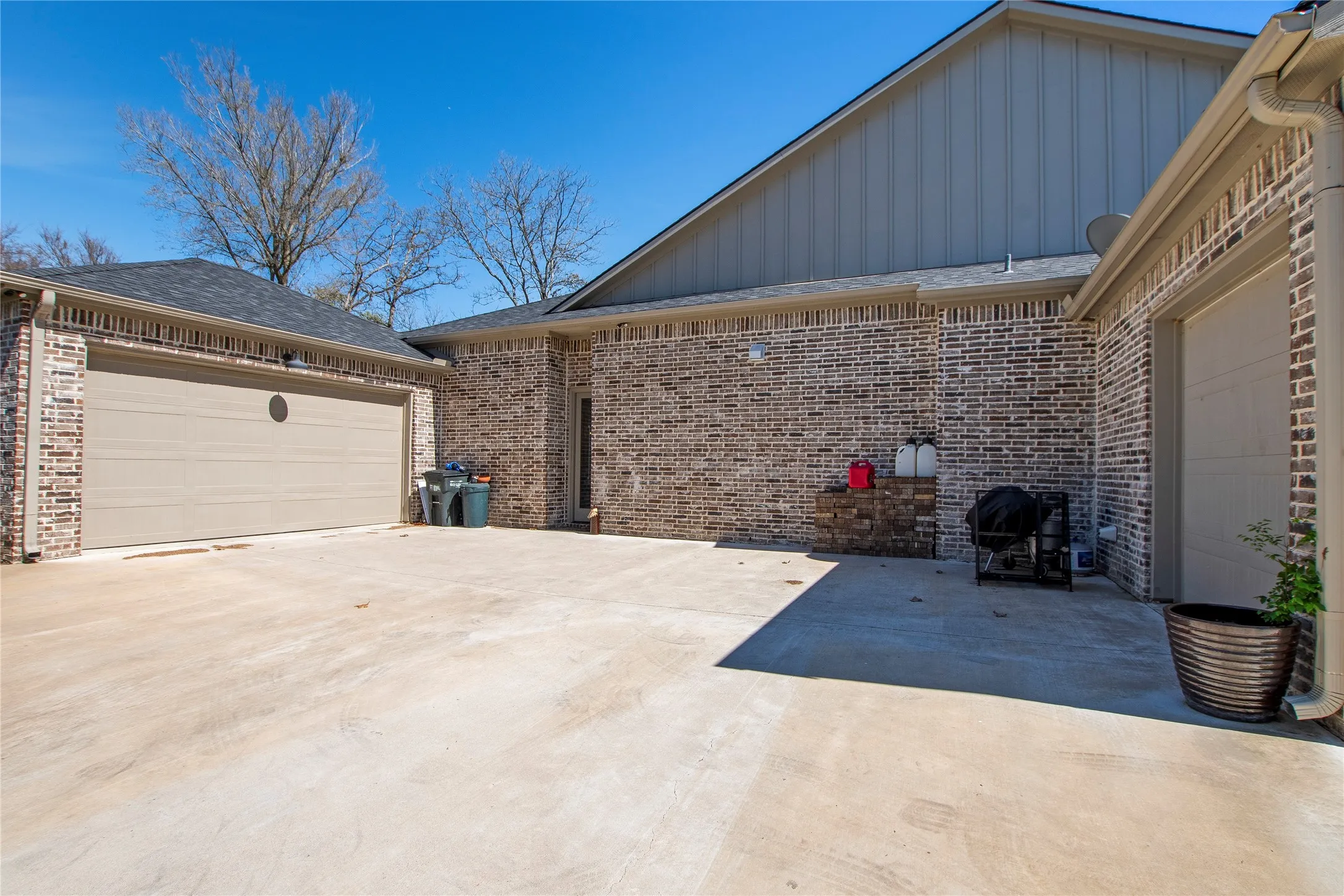 Two car garage plus a 1 car garage with room for golf cart storage