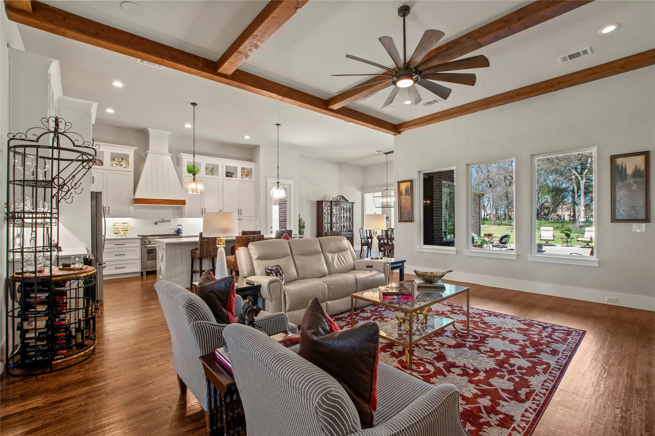 Large windows overlooking park like back yard.