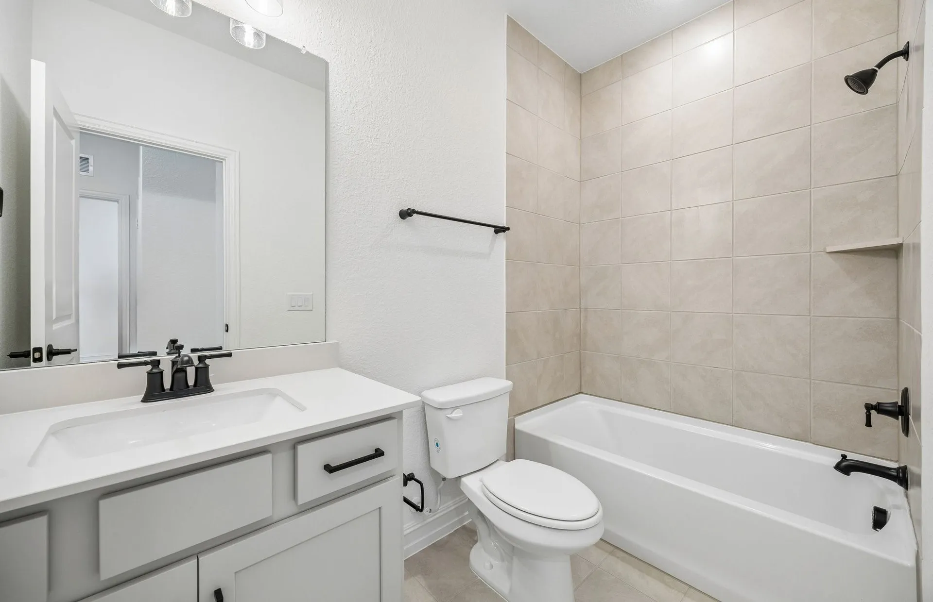 Secondary bath with tile surrounded shower