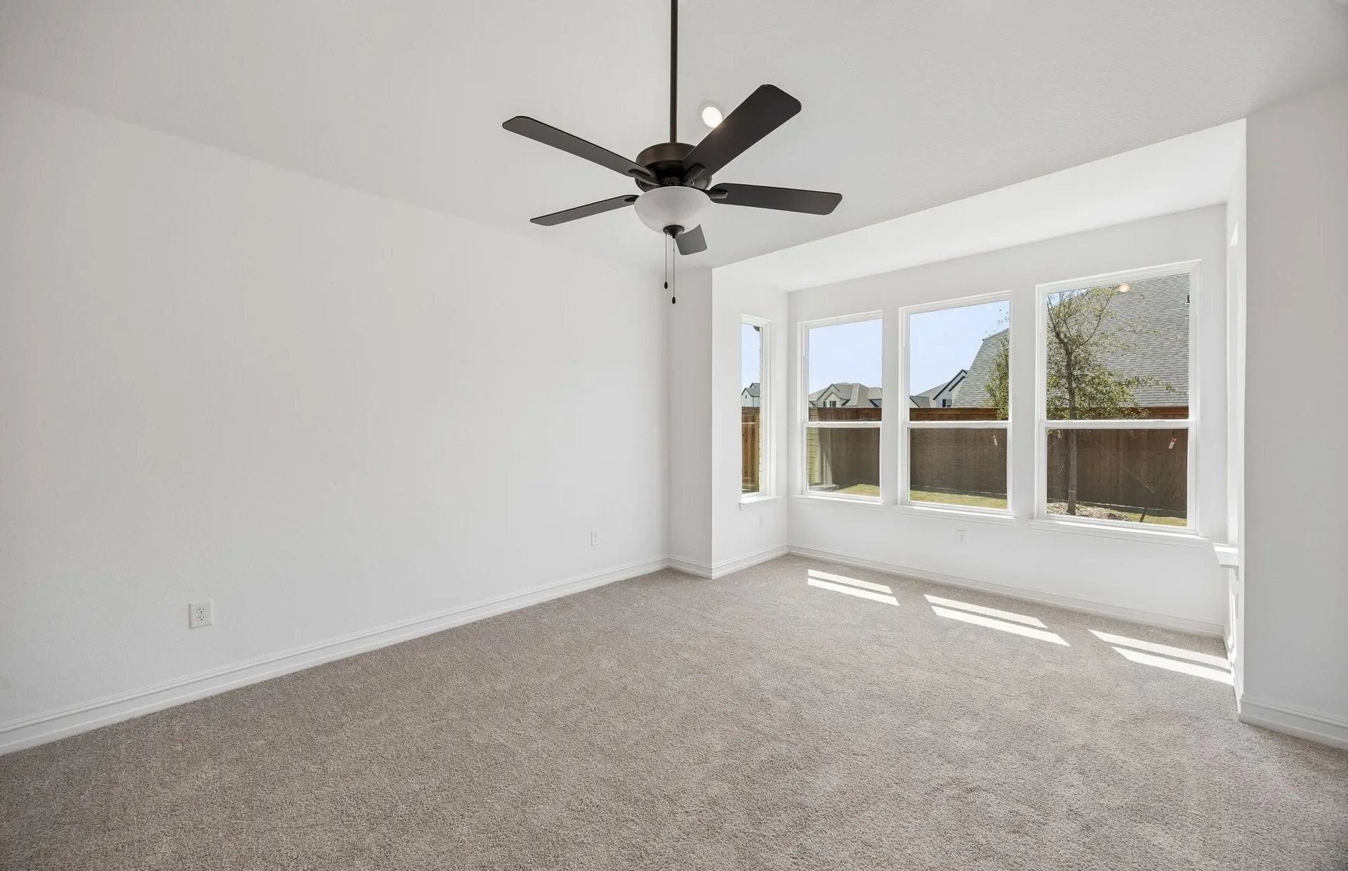 Primary bedroom with bay windows