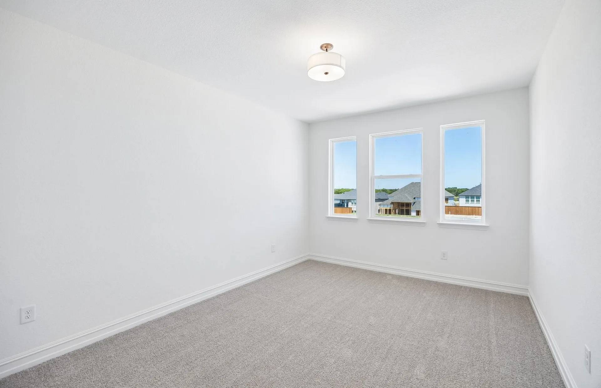 Secondary bedroom with large windows