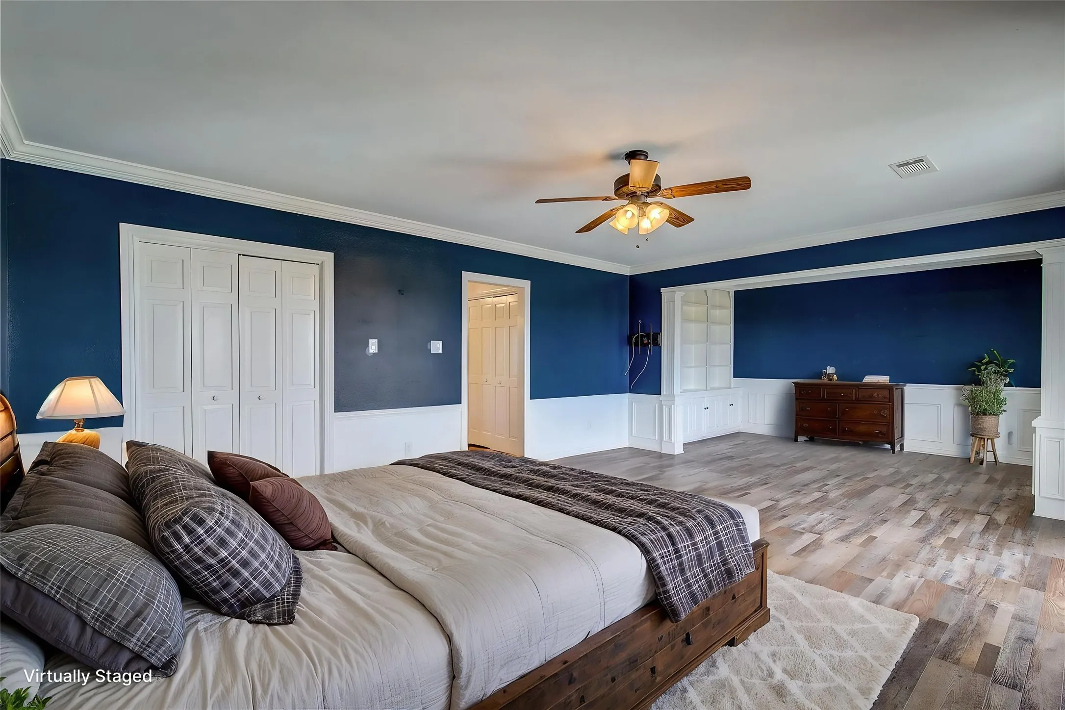 upstairs primary is huge, with separate library/seating area, crown molding, wainscoting, two closets