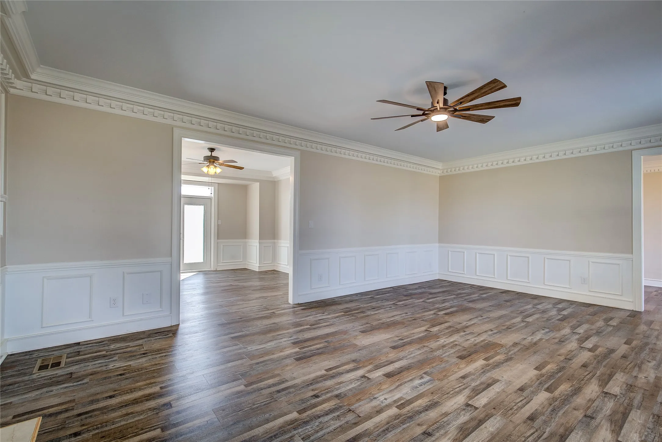 Living room opens into formal dining room