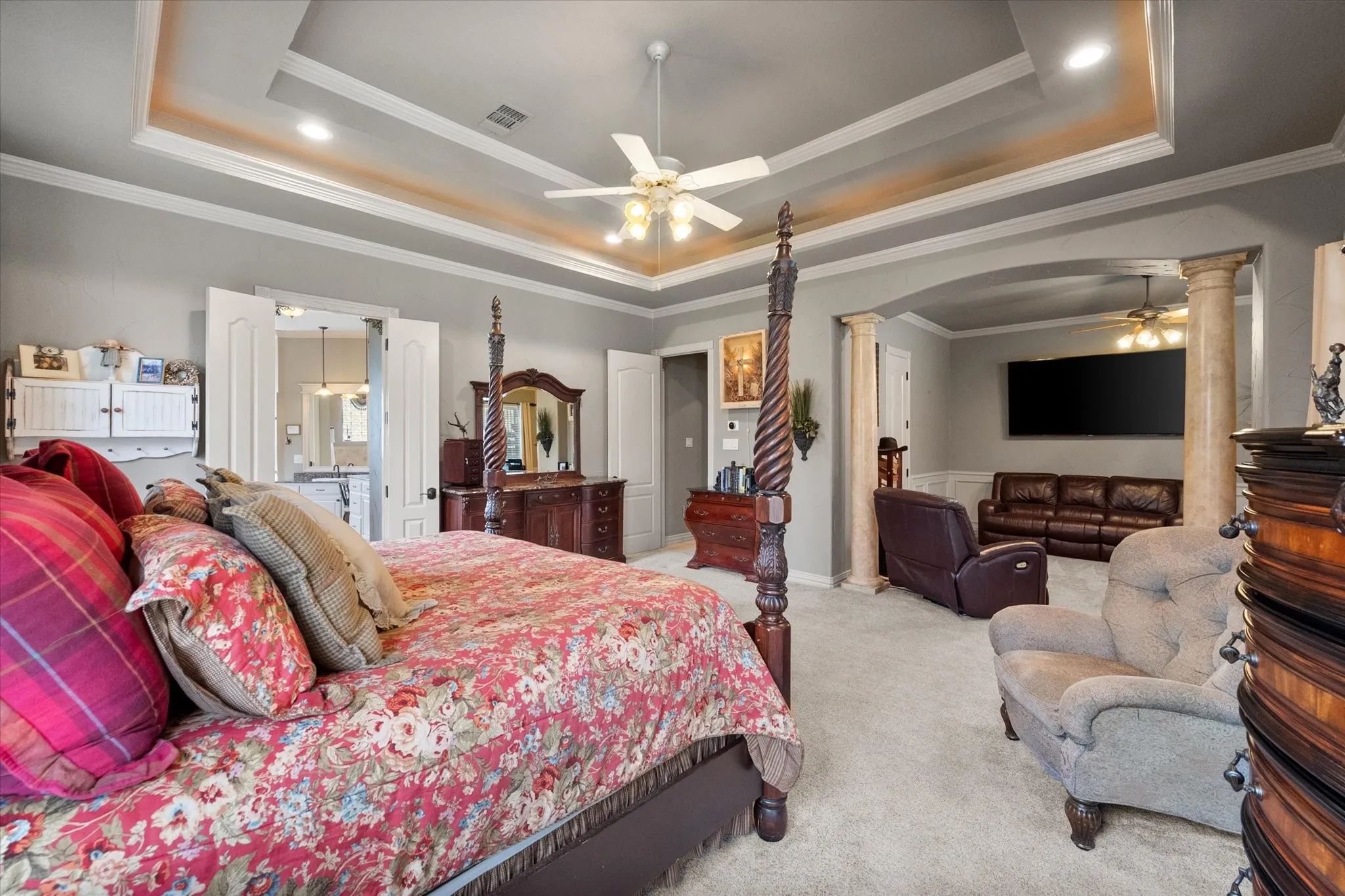 Tray ceiling with recessed lighting and crown molding