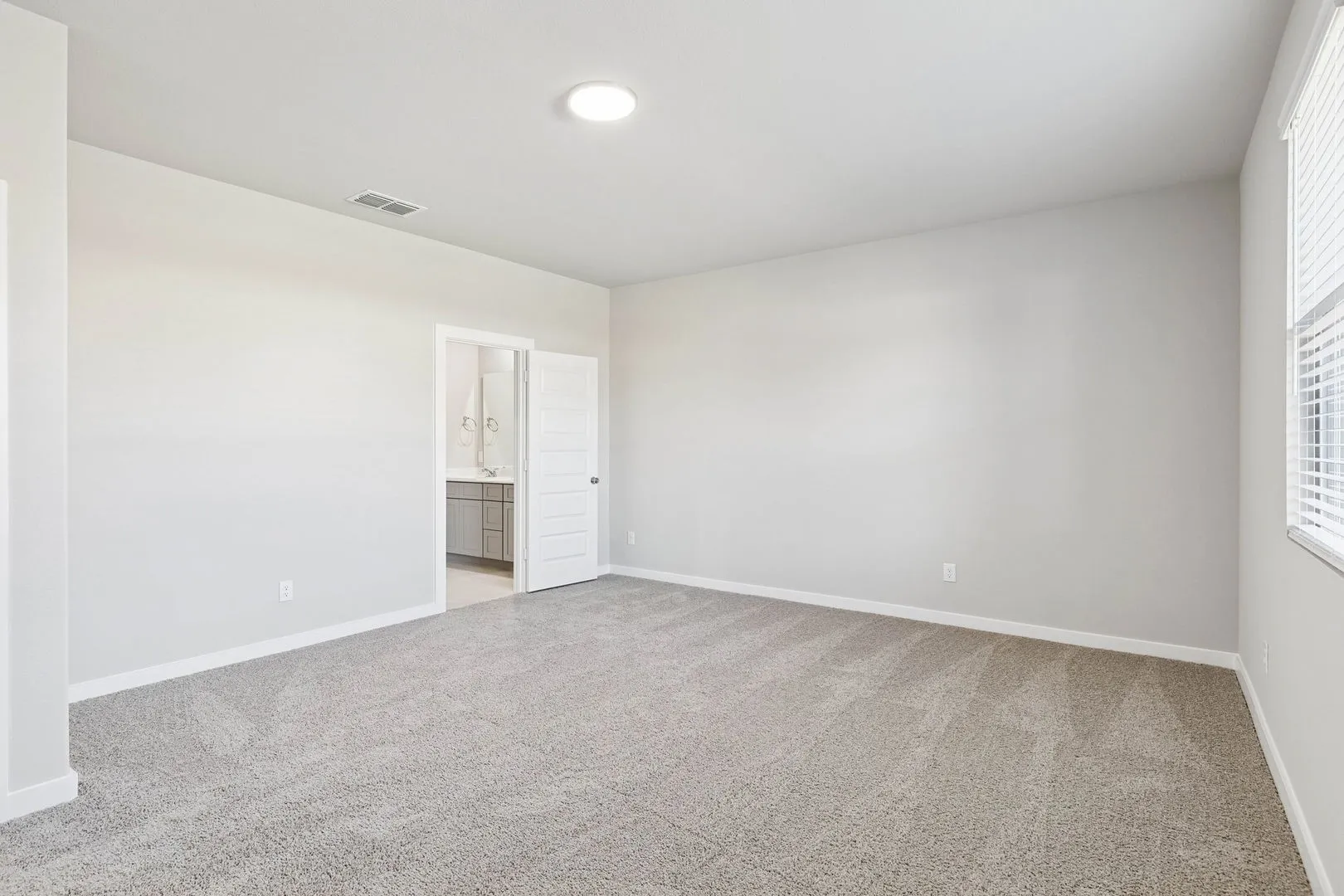 Primary Suite in the Haylee home plan by Trophy Signature Homes - REPRESENTATIVE PHOTO