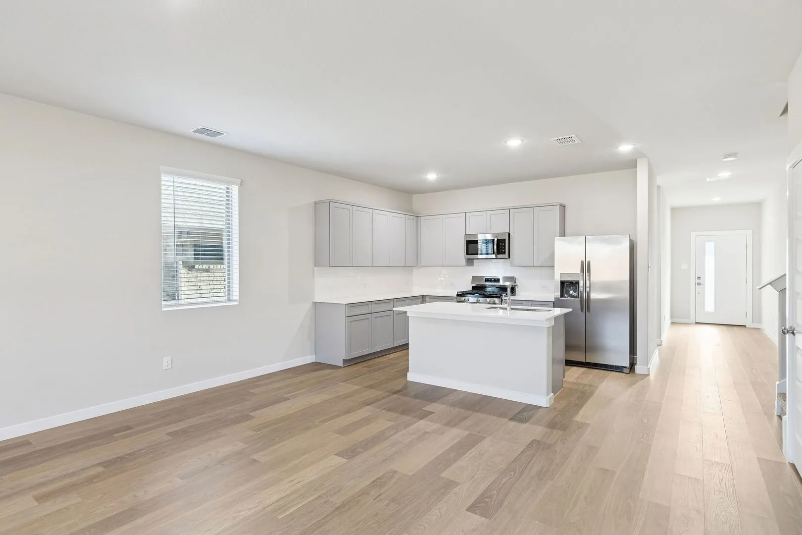 Kitchen and Dining Room in the Haylee home plan by Trophy Signature Homes - REPRESENTATIVE PHOTO